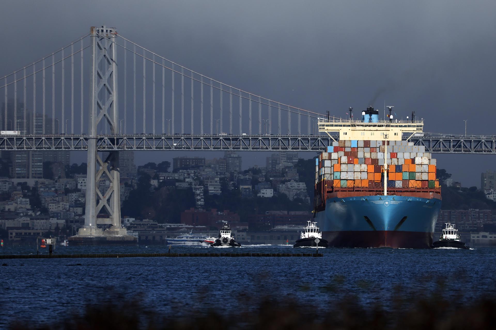 A container ship pulls into the Port of Oakland on August 01, 2025 in Oakland, California.