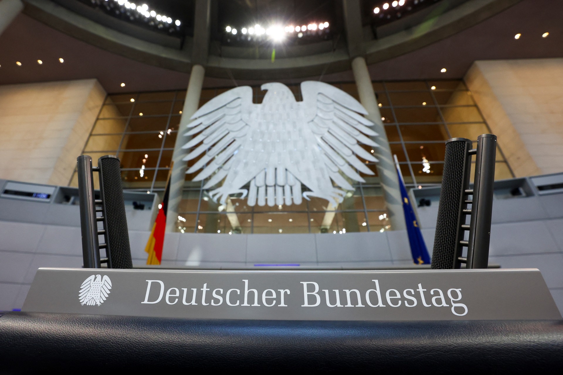 Workers prepare the plenary hall of the German lower house of Parliament, in Berlin