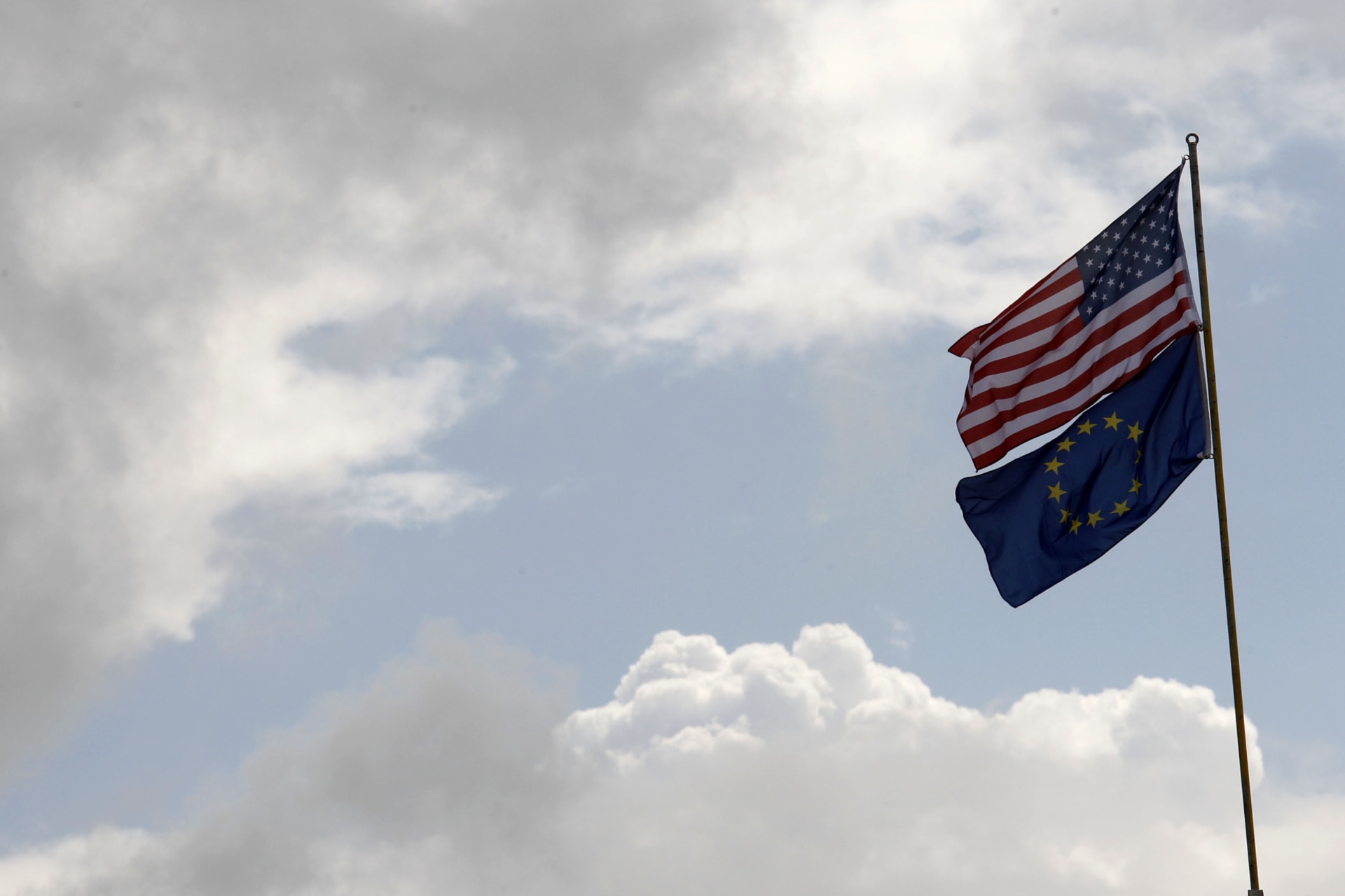 The flags of the U.S. and the European Union are pictured upon a roller coaster at a German-American folk festival in Berlin