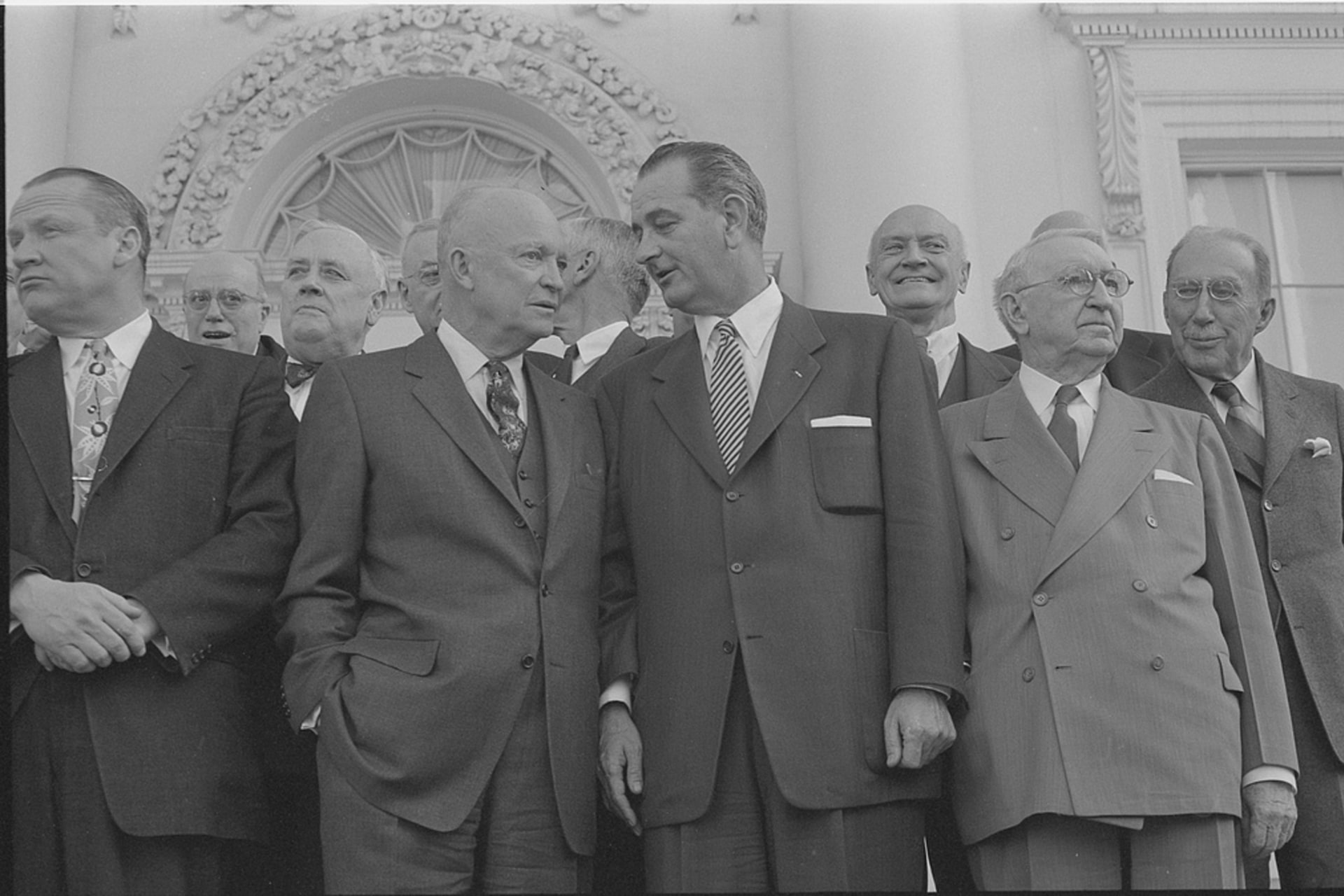 <p>President Dwight D. Eisenhower, then-Senator Lyndon B. Johnson, and Secretary of State John Foster Dulles stand together during a luncheon at the White House, March 31, 1955.</p>
