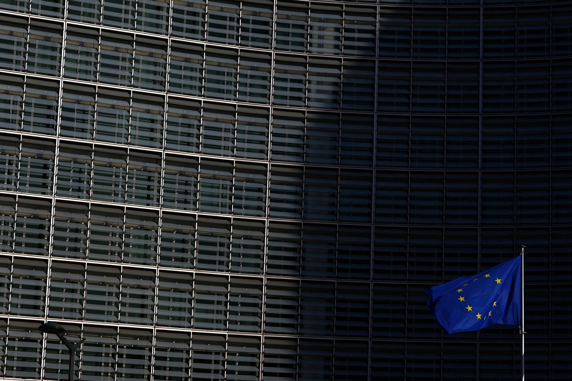 A European Union flag flutters outside the European Commission headquarters in Brussels