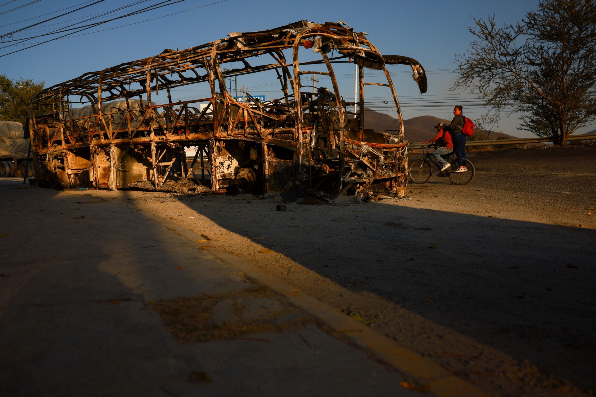 <p>A burned bus following a series of roadblocks and attacks by organized crime after a military operation that killed cartel leader Nemesio Oseguera, “El Mencho,” who died while being transported in a helicopter after being injured during the raid, near Guadalajara, Mexico, February 24, 2026.</p>
