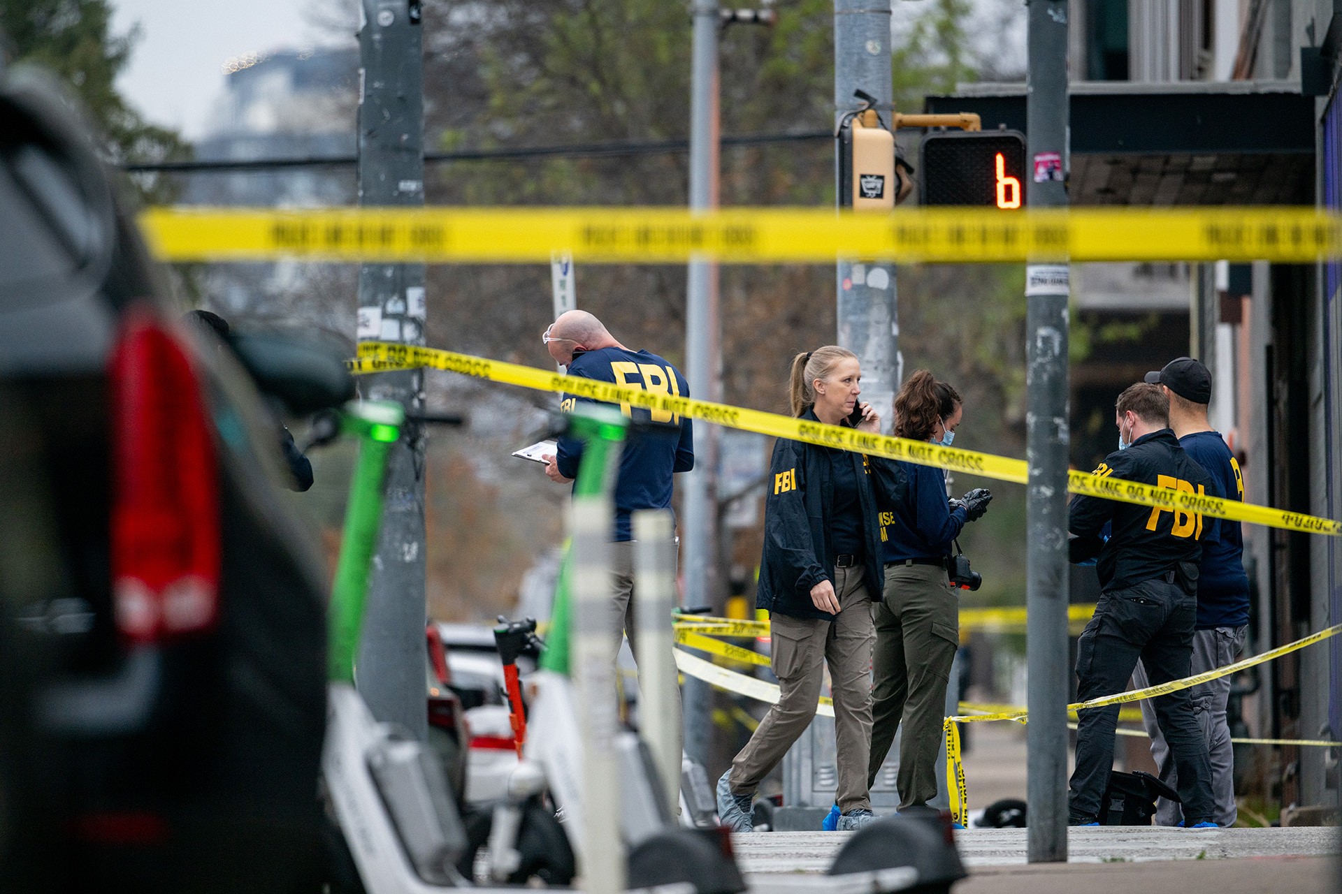 Members of the FBI perform an investigation near Buford's bar in downtown on March 01, 2026 in Austin, Texas. 