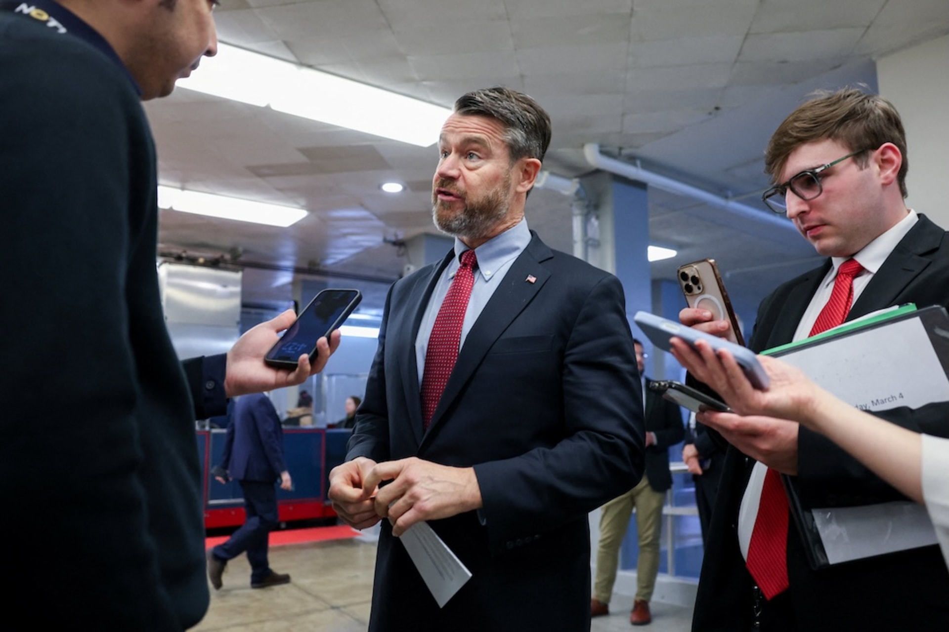 <p>U.S. Senator Todd Young (R-IN) speaks with reporters in the Senate subway during a vote in the U.S. Senate on a bipartisan war powers resolution aiming to stop the military campaign against Iran, on Capitol Hill in Washington, D.C., U.S., March 4, 2026. </p>
