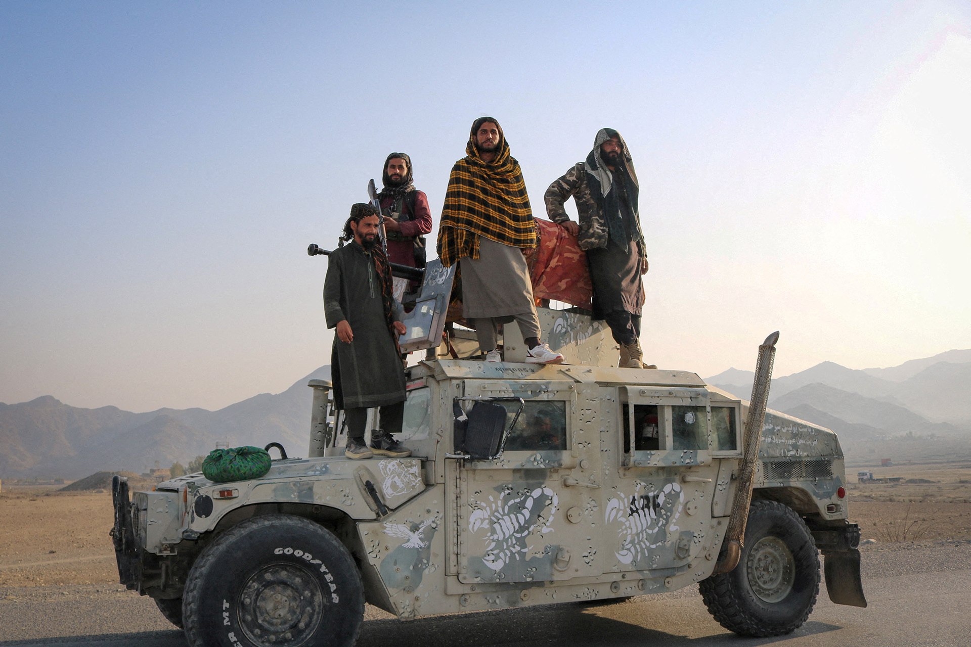 Taliban soldiers pose as they stand on a Humvee, following exchanges of fire between Pakistani and Afghan forces, in Momand Dara, Nangarhar province, Afghanistan, February 28, 2026.