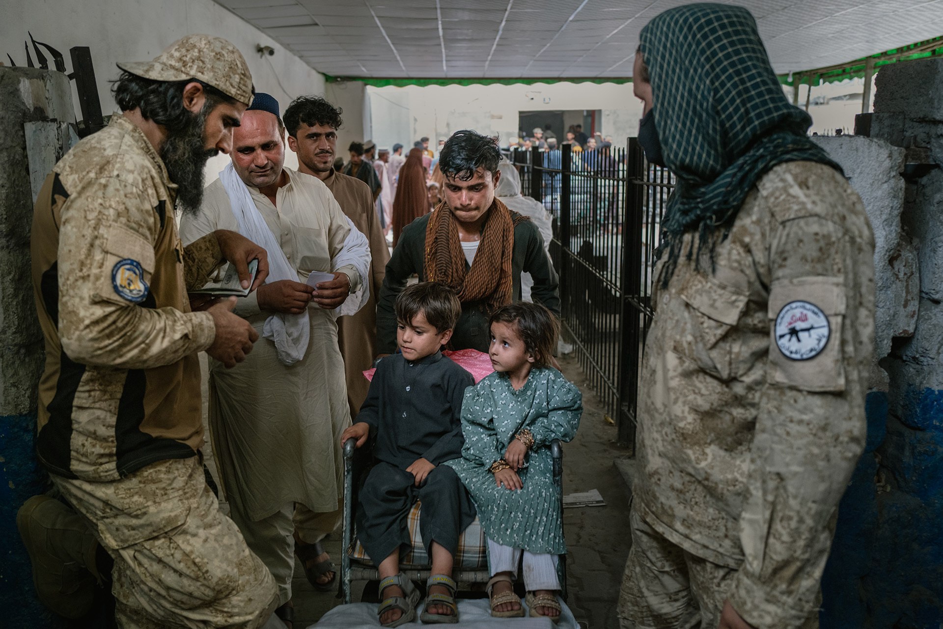 Afghan migrants cross the Torkham border crossing on September 15, 2025 in Torkham, Afghanistan.