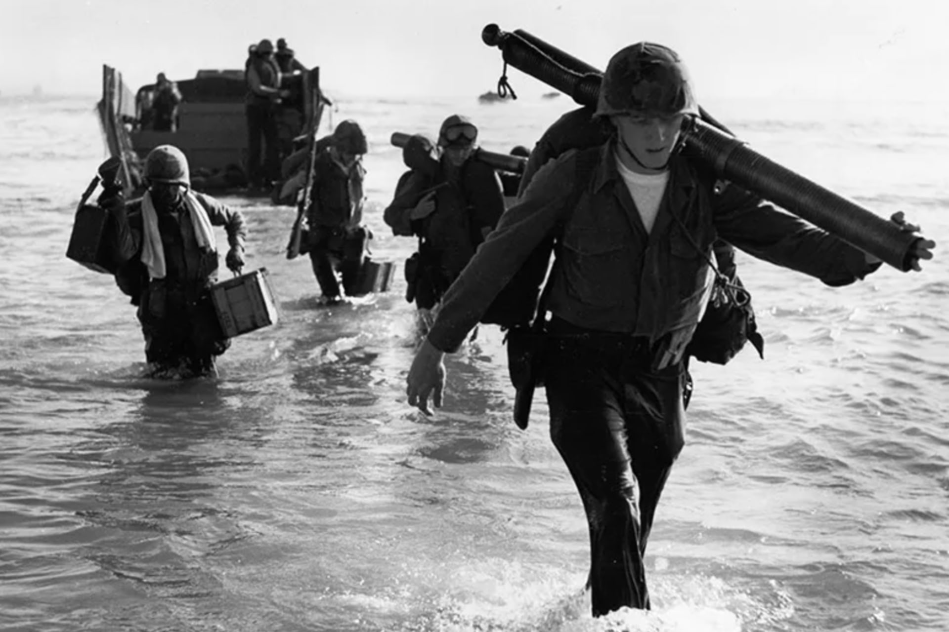 <p>United States Marines of the 9th Expeditionary Brigade wade ashore at Da Nang, Vietnam, March 8, 1965.</p>
