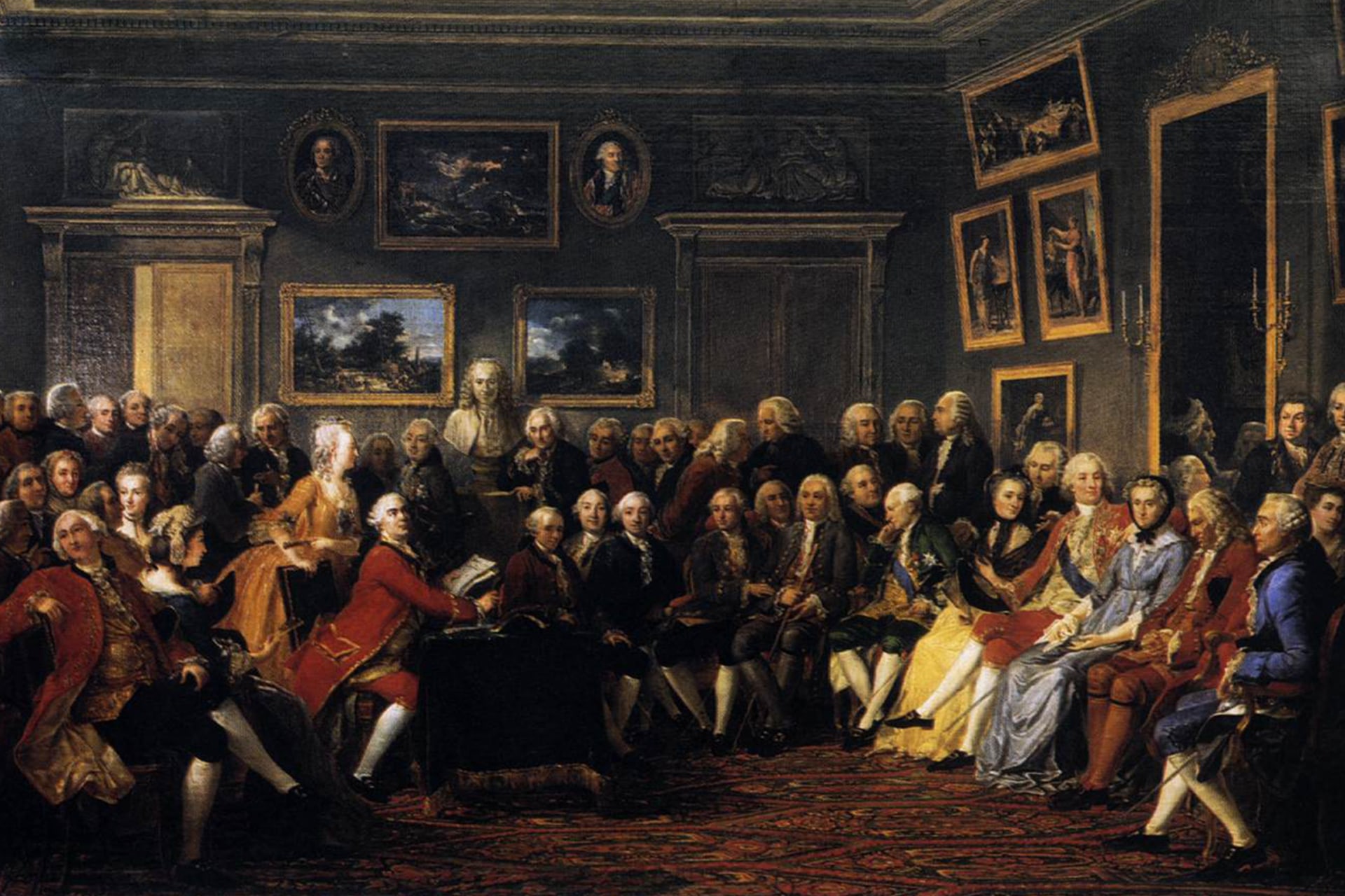 A painting depicts Enlightenment thinkers — including Jean-Jacques Rousseau, Montesquieu, and a bust of Voltaire — in a drawing room, gathered for a reading of Voltaire’s play “L’Orphelin de la Chine” in 1755.