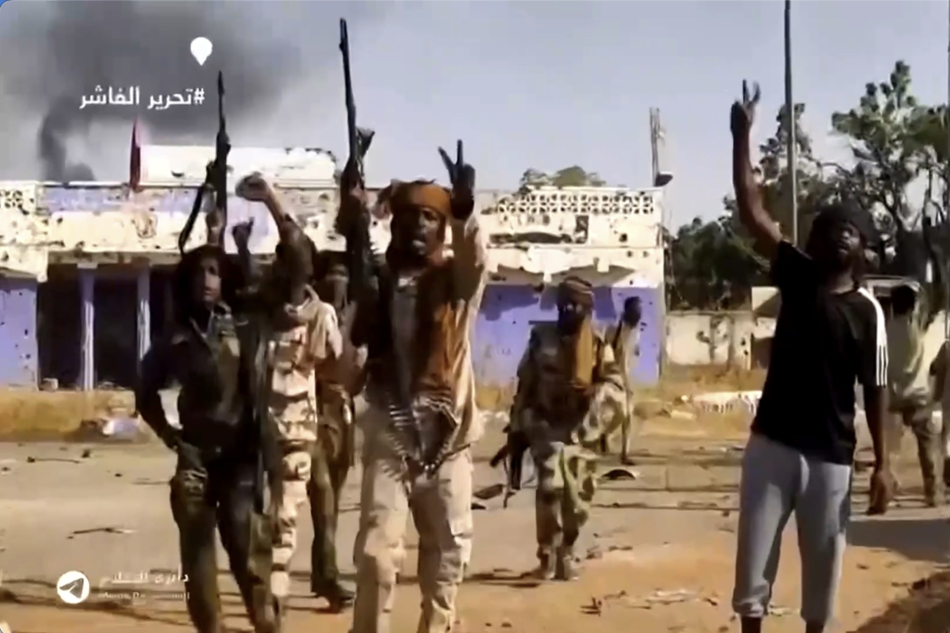 <p>Soldiers who have been identified as RSF members cheer in El Fasher after their takeover on October 26, 2025.</p>
