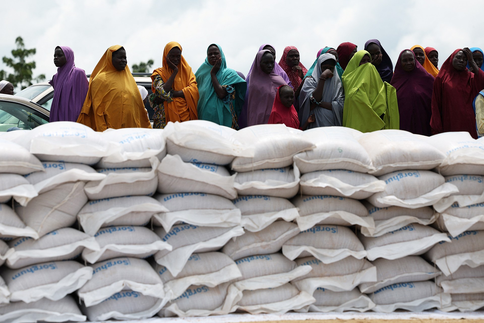 <p>Beneficiaries from different displacement camps wait to receive support at a World Food Program distribution center in Dikwa, Borno State, Nigeria, August 27, 2025.</p>
