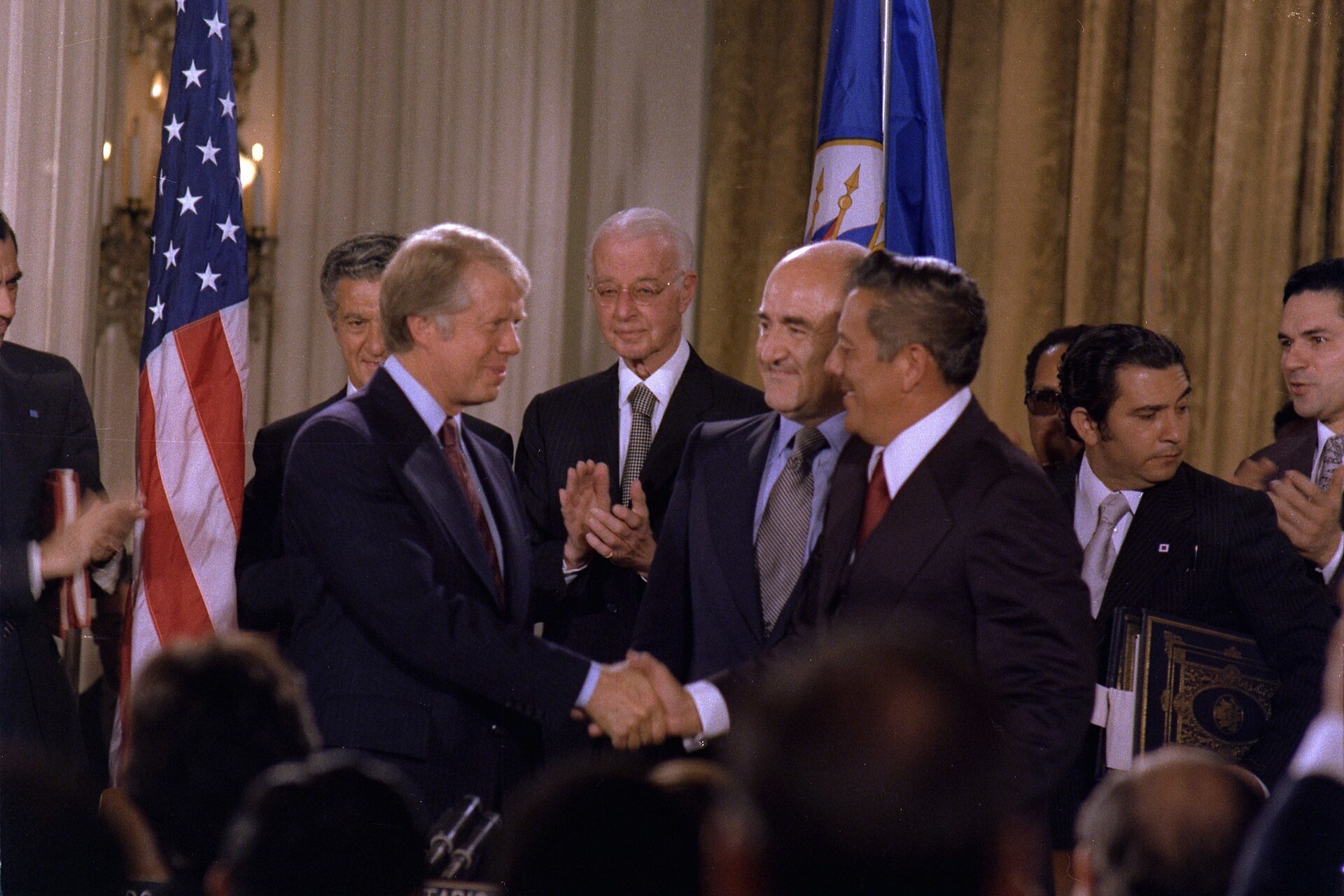 <p>President Jimmy Carter and Panamanian General Omar Torrijos shake hands after signing the Panama Canal Treaties, September 7, 1977.</p>
