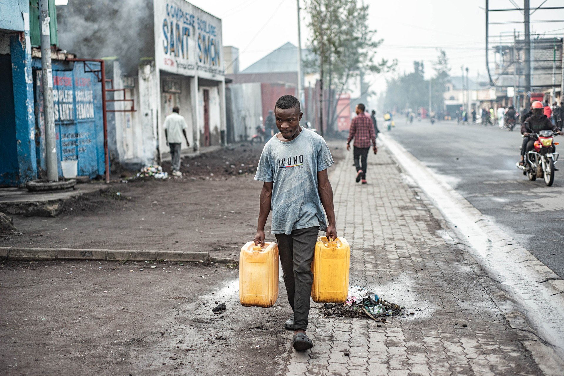 A man carries water jugs during a drinking water shortage in Goma, Democratic Republic of Congo, February 1, 2025.