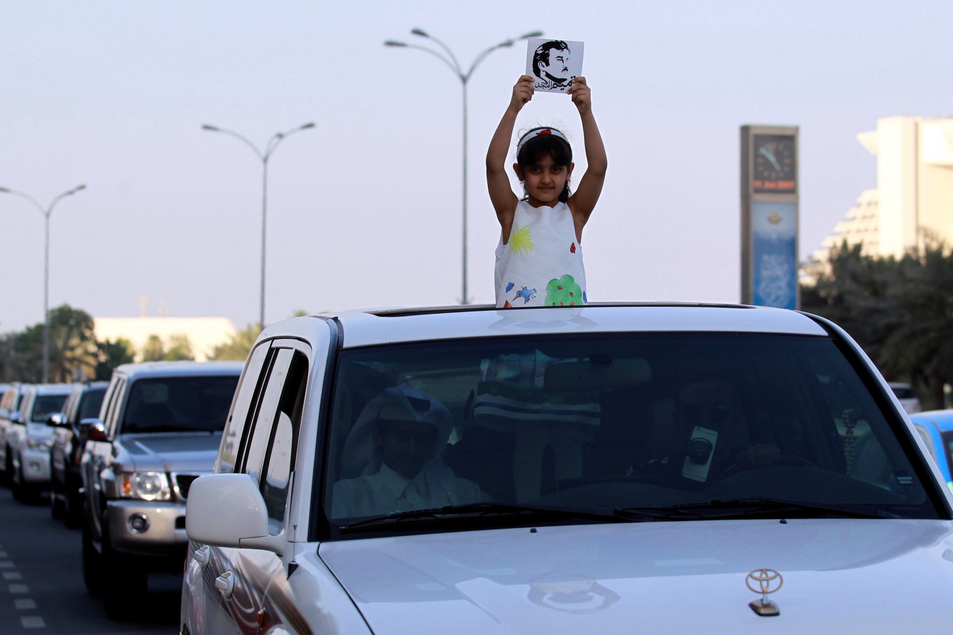 <p>A girl holds a picture depicting Qatar’s Emir Sheikh Tamim Bin Hamad Al-Thani during a demonstration in support of him in Doha, Qatar June 11, 2017.</p>
