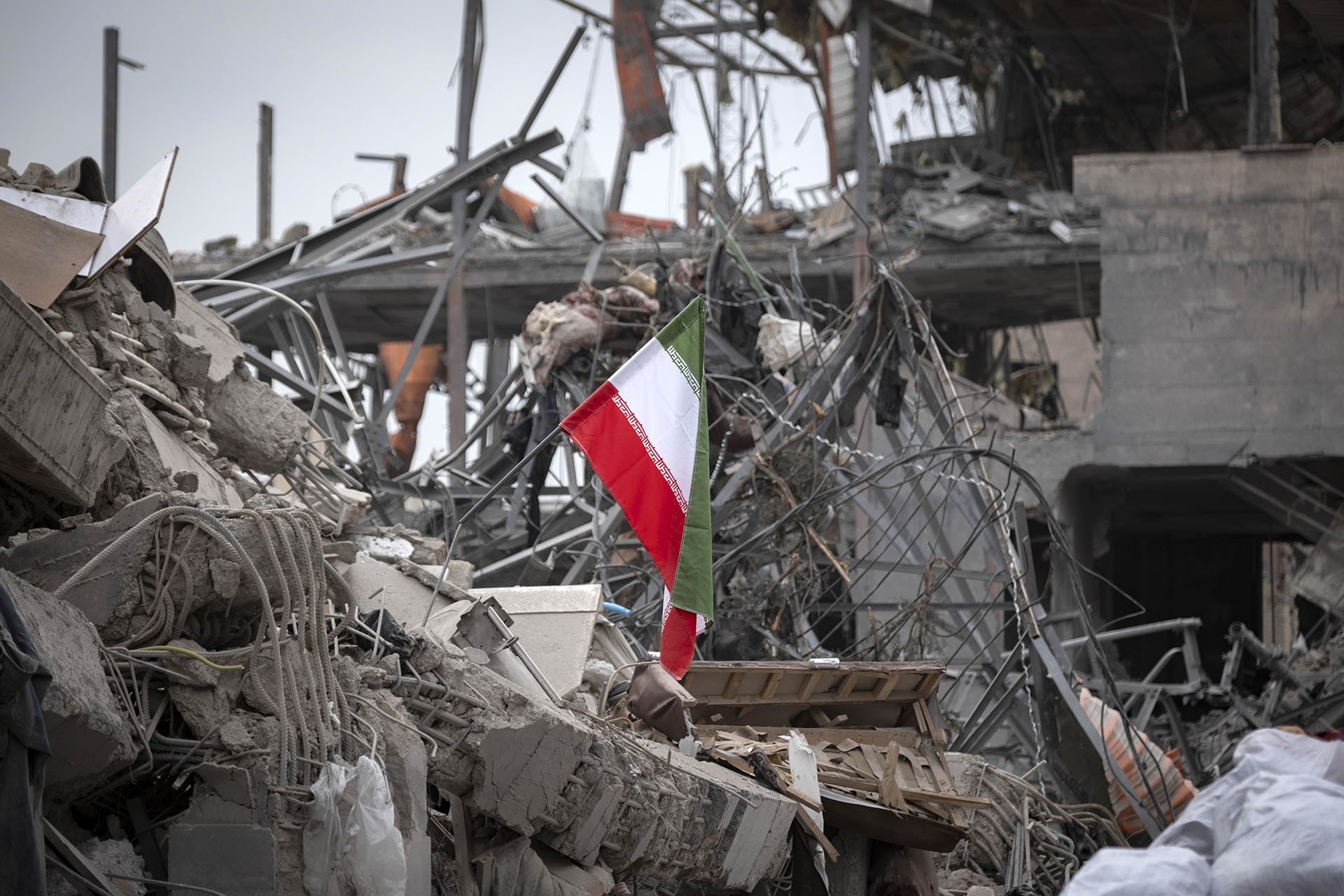 <p>A national flag is placed on the ruins of a building that is destroyed during the U.S.-Israeli military campaign that strikes a residential area on March 9, 2026, in Tehran, Iran, on March 12, 2026. </p>
