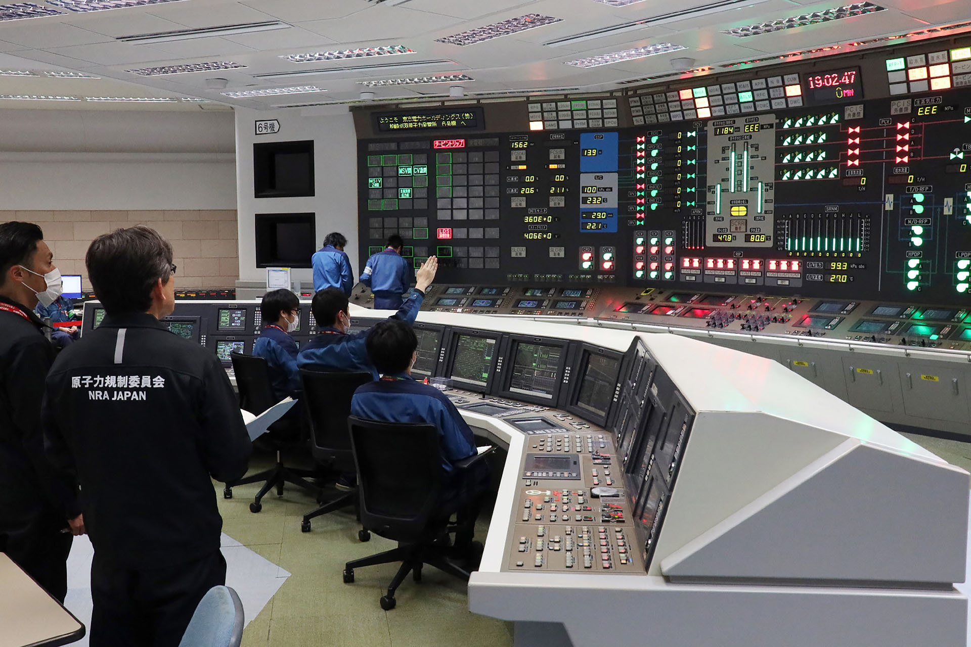 Image of nuclear power plant workers in Japan.