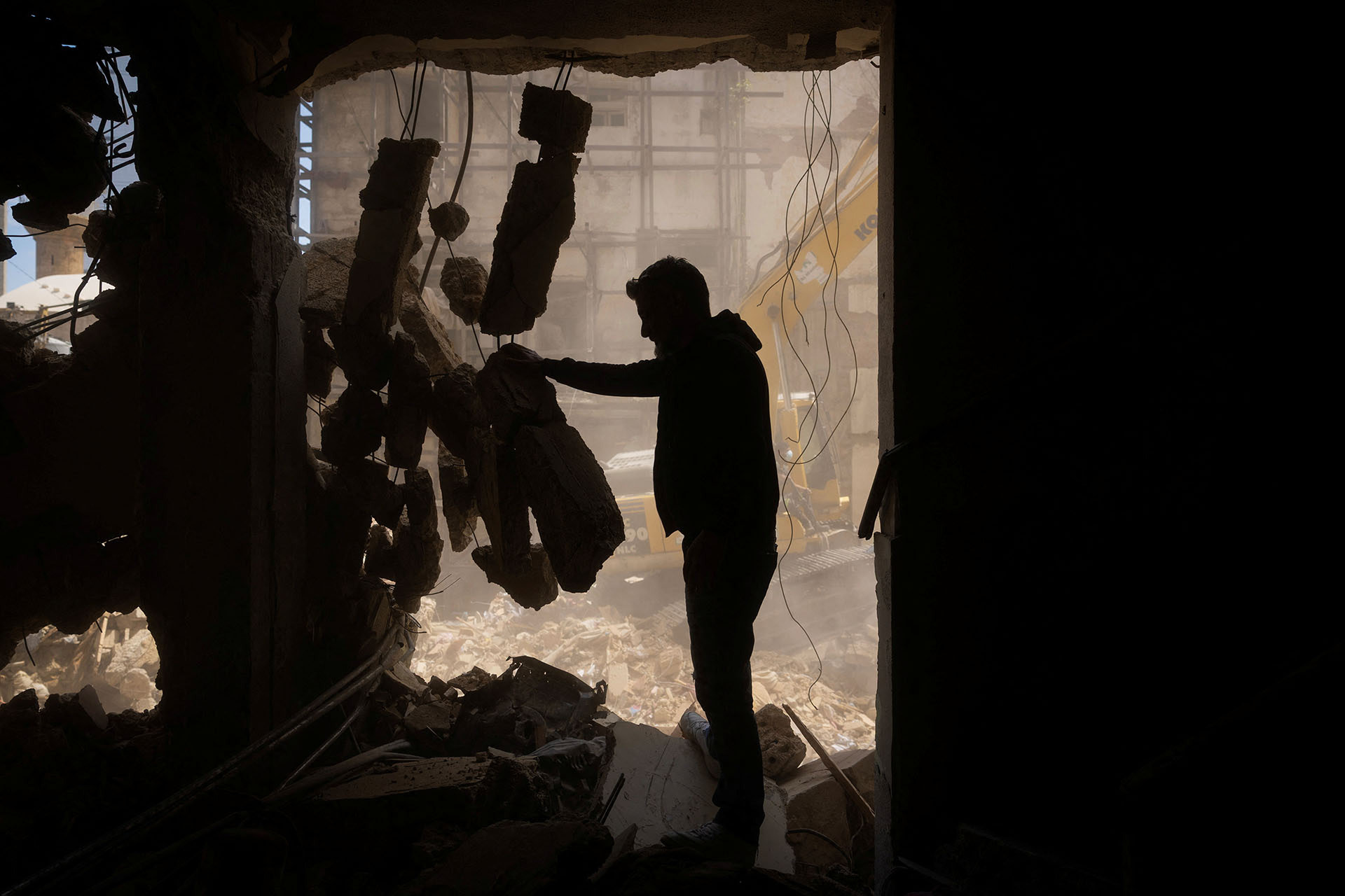 <p>A man stands inside his house damaged during Israeli strikes on Wednesday, in Ain Al Mraiseh, Beirut, Lebanon, April 10, 2026. </p>
