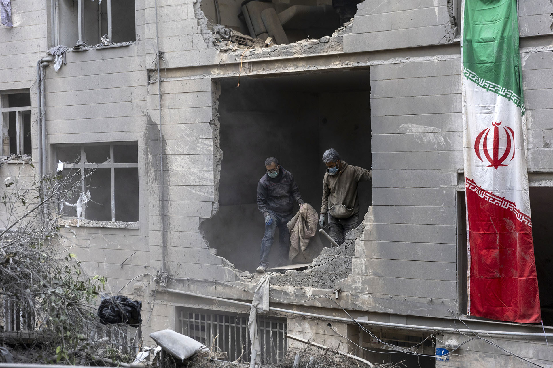 <p>People clear rubble in a house in the Beryanak District on March 15, 2026, in Tehran, Iran. </p>
