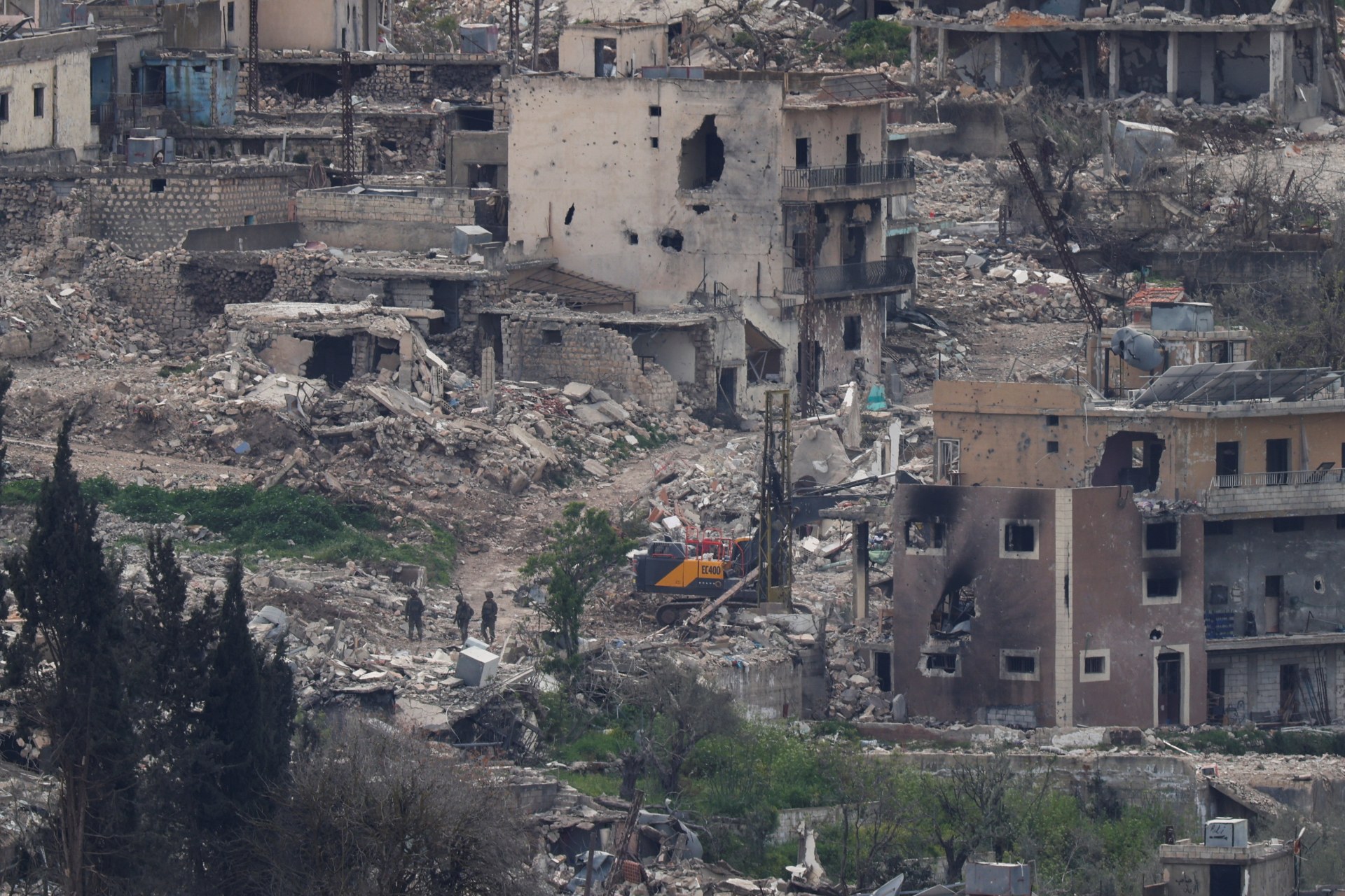 <p>Israeli soldiers stand among destroyed buildings in southern Lebanon, April 14, 2026.</p>
