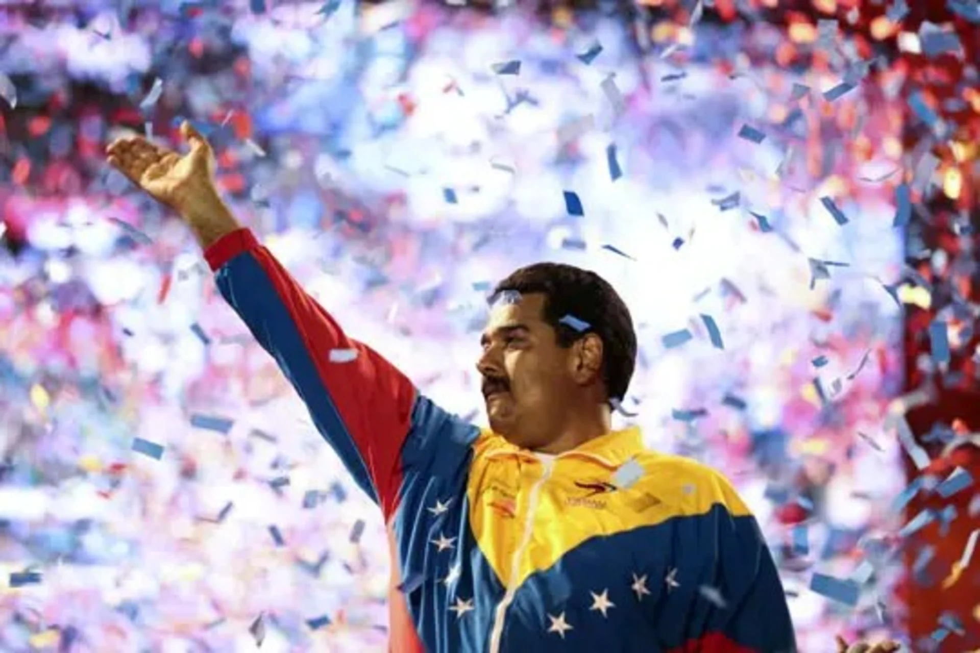 Nicolás Maduro waves to supporters during a campaign rally.
