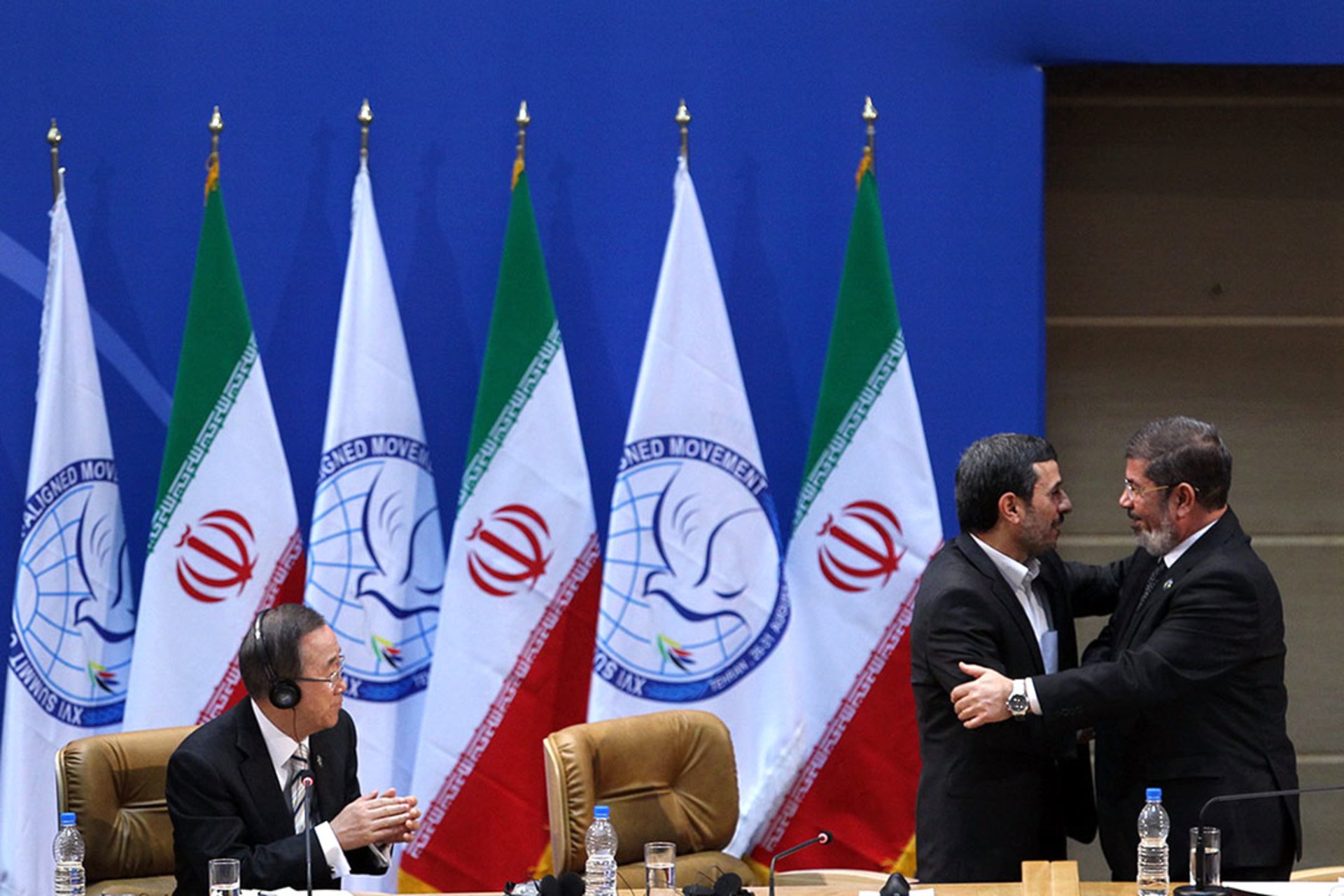 Iranian President Mahmoud Ahmadinejad talks to Egypt’s president, Mohammed Morsi, during the sixteenth summit of the Nonaligned Movement in Tehran.