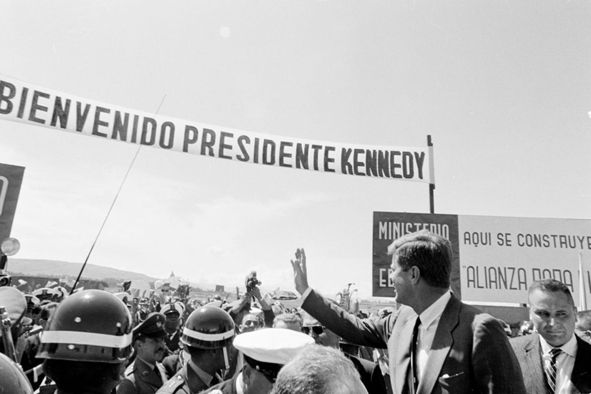 U.S. President John F. Kennedy waves to a crowd in Bogota during a ceremony celebrating a new housing project built through his Alliance for Progress initiative in December 1961. White House Photographs
