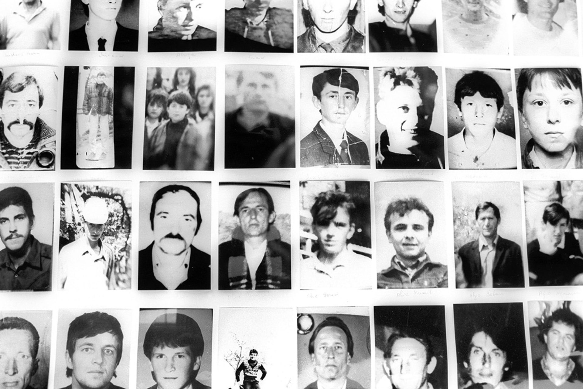 Photographs of missing men from Srebrenica are on display in the office of the Srebrenica Widow’s Association in Tuzla, Bosnia-Herzegovina, October 22, 2002. Roger Lemoyne/Getty Images