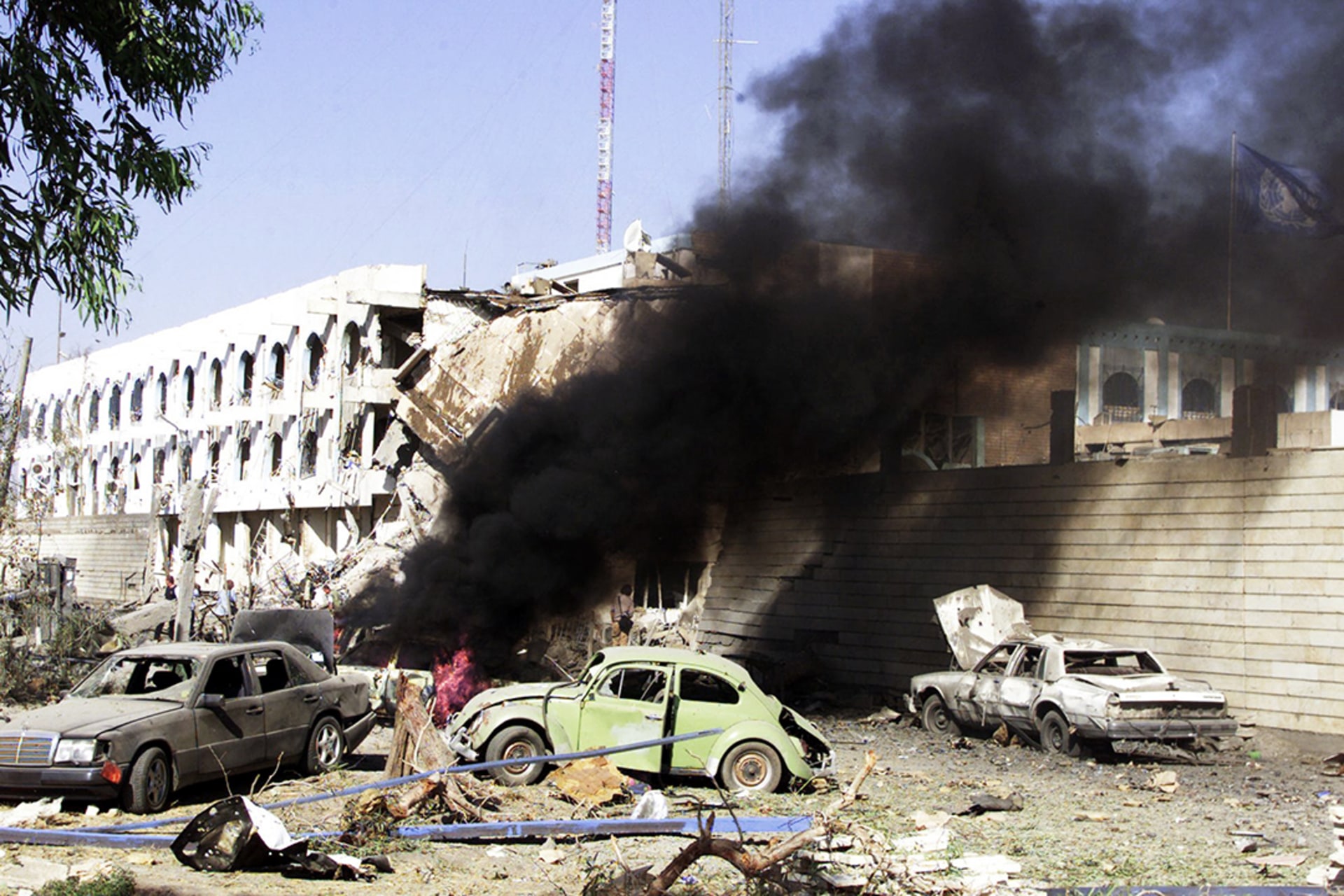 A car burns outside the UN headquarters at the Canal Hotel in eastern Baghdad after a truck bomb attack, August 19, 2003. Sabah Arar/AFP/Getty Images