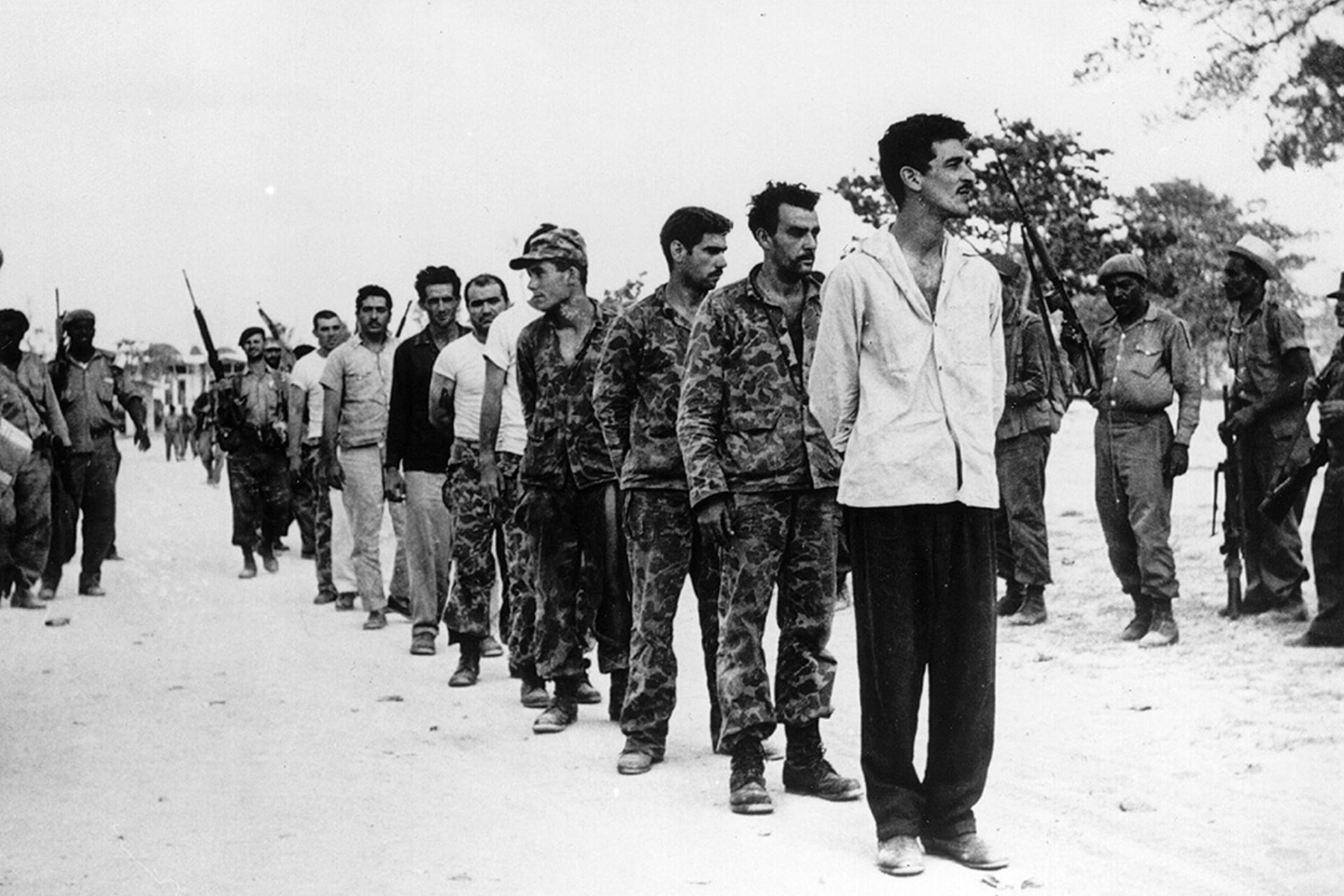 Cubans who participated in the Bay of Pigs invasion line up on the Playa Giron in Cuba after being captured in April 1961.