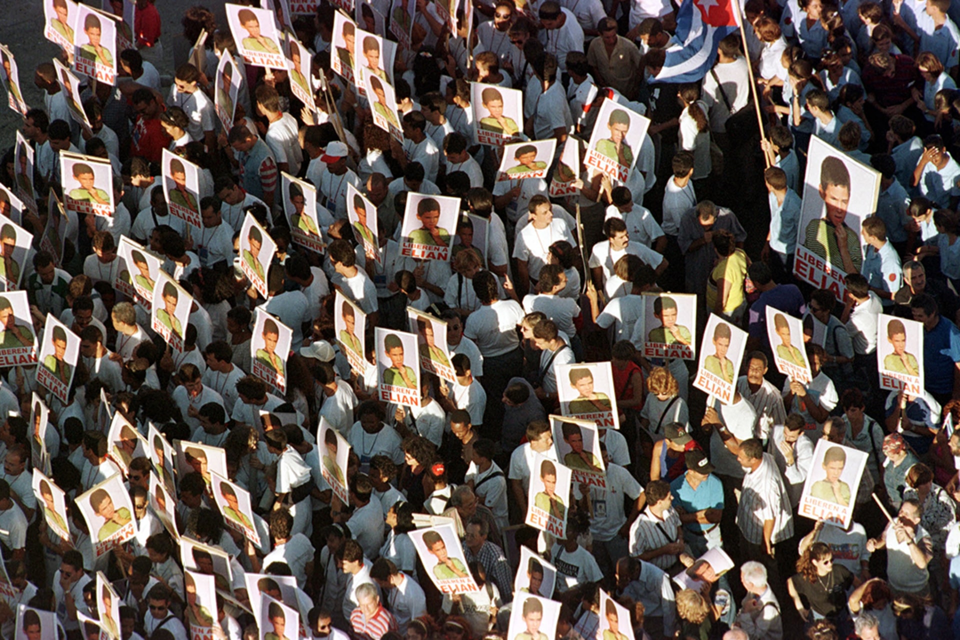 Protesters hold images of Elian Gonzalez during a demonstration in front of the United States Interests Section of the Embassy of Switzerland in Havana, Cuba. 
