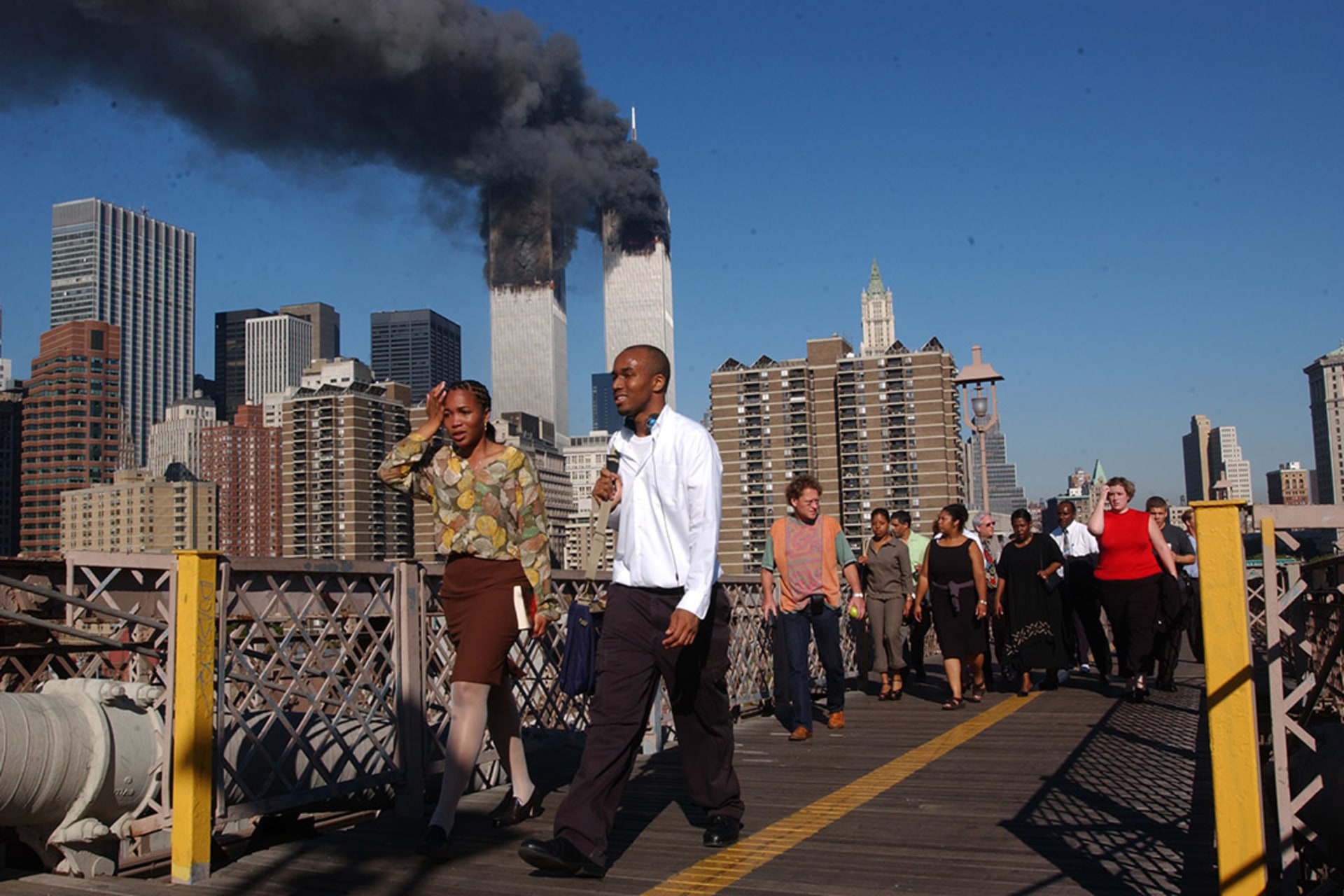 New Yorkers flee downtown Manhattan across the Brooklyn Bridge as the World Trade Center towers burn. Spencer Platt/Getty Images
