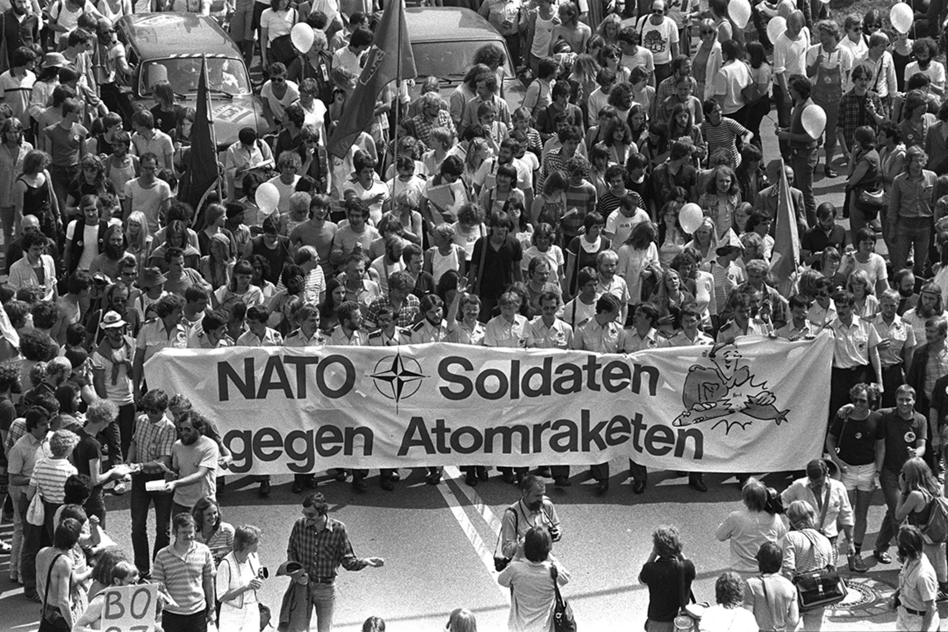 West German soldiers and civilians march with a banner reading "NATO soldiers against nuclear missiles" in a demonstration attended by about 150,000 people in Bonn, June 10, 1982.