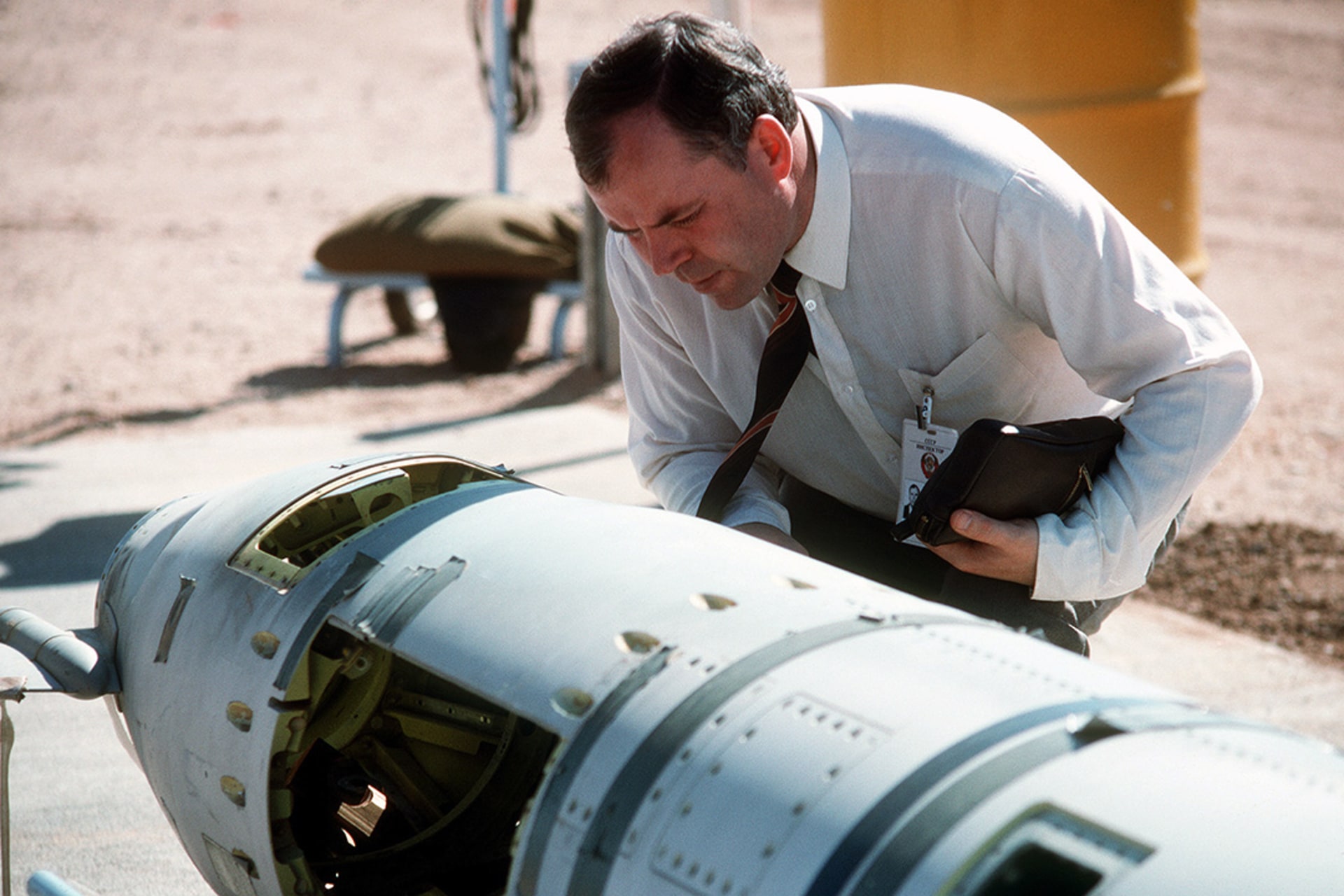 A Soviet inspector examines a BGM-109G Tomahawk ground-launched cruise missile prior to its destruction in October 1988.

