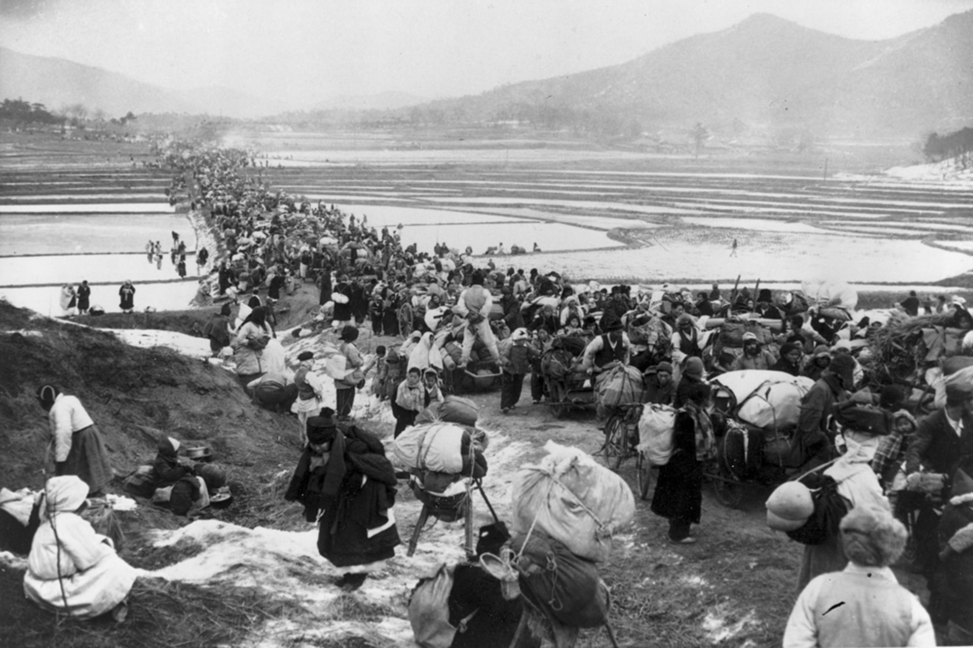 Korean refugees block a bridge south of Seoul as they flee advancing Communists. 
