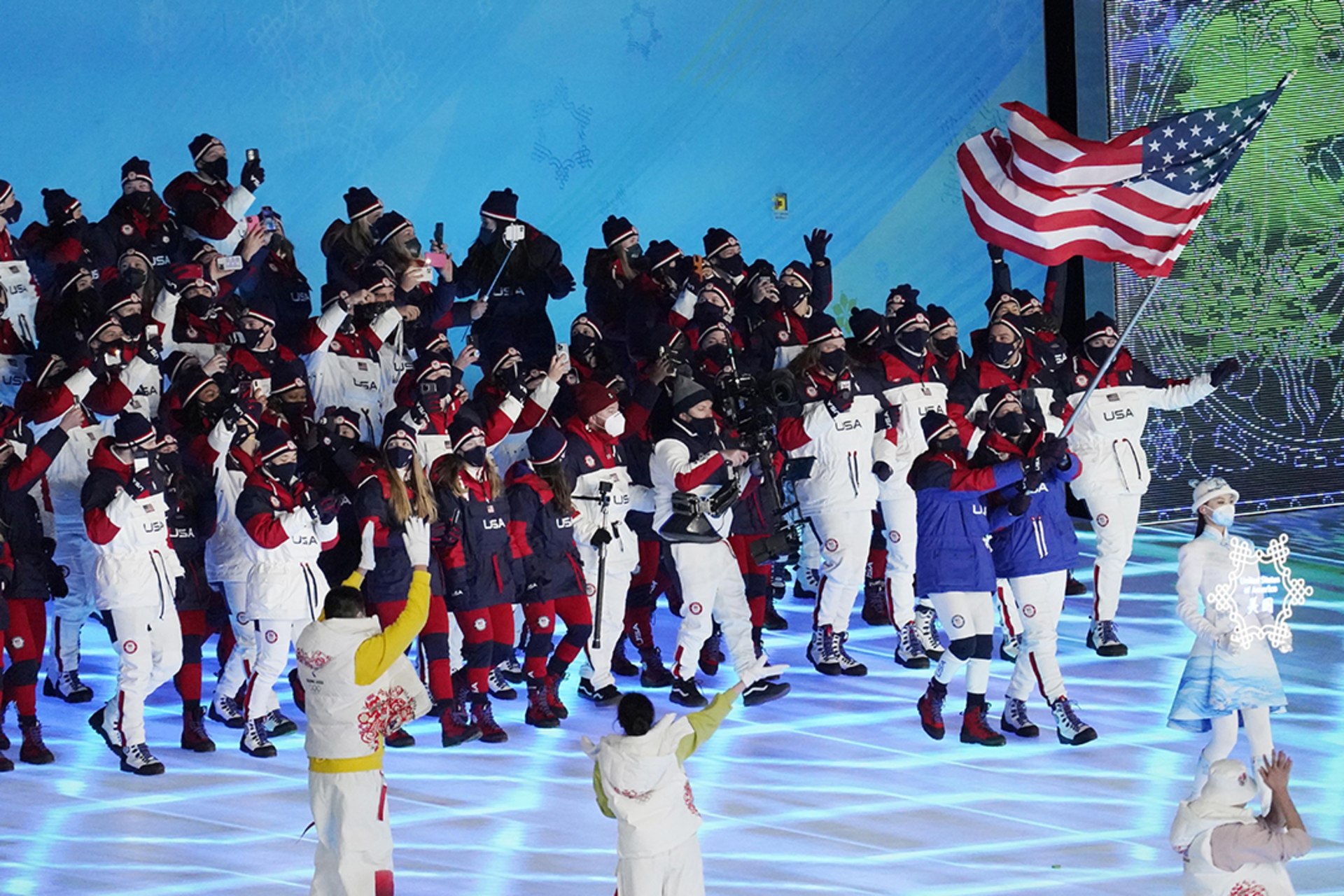 U.S. athletes walk during the Olympics opening ceremony in Beijing.