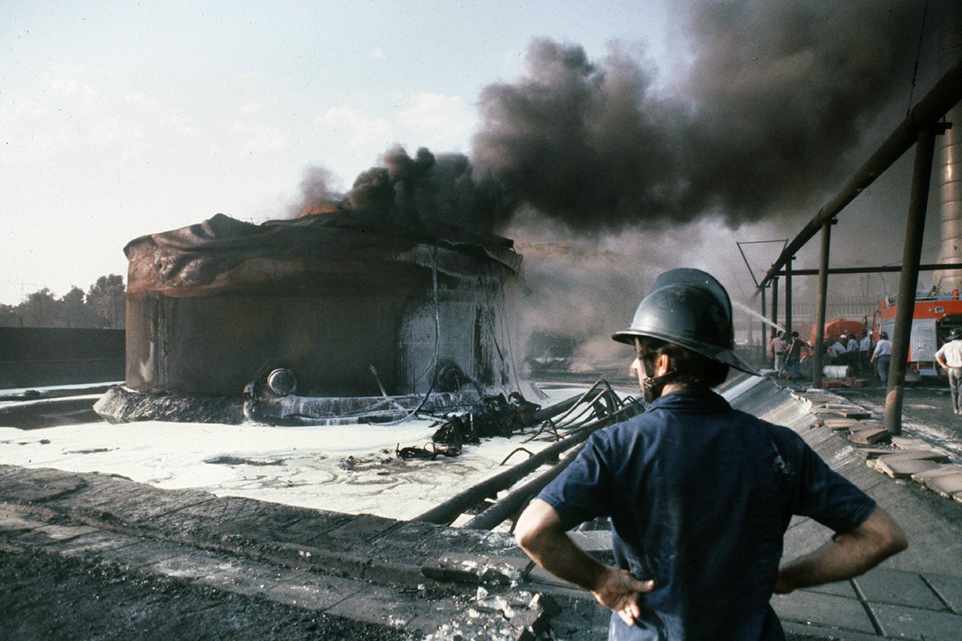 A burning fuel tank bombed by Iran in Baghdad, October 1980.