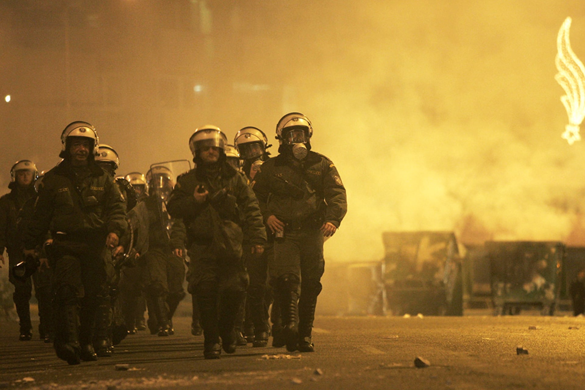 Riot police respond to protests against the privatization of the Port of Piraeus in January 2008, set to be auctioned off to raise funds for the struggling Greek state. 
