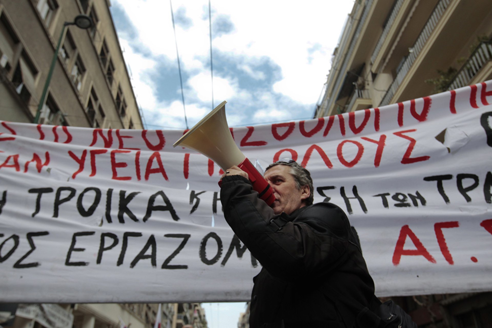 Doctors and other health-care workers protest pay cuts during a February 2012 demonstration in Athens against a new bailout deal that expands austerity measures.