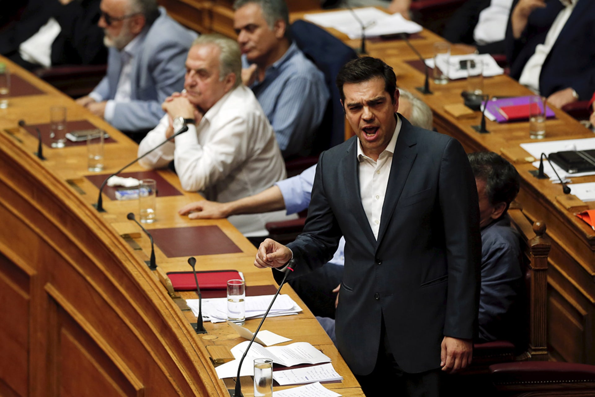 Prime Minister Alexis Tsipras exhorts the Greek parliament to approve a sweeping package of austerity measures in a speech ahead of the vote on July 16, 2015. 
