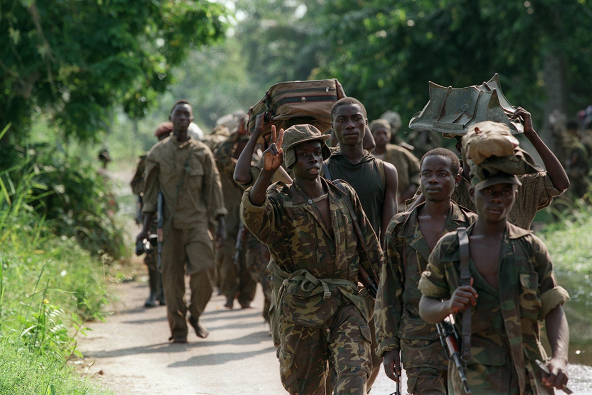 An AFDL soldier flashes the victory sign as his unit marches on Kinshasa in May 1997. Christophe Simon/AFP/Getty Images