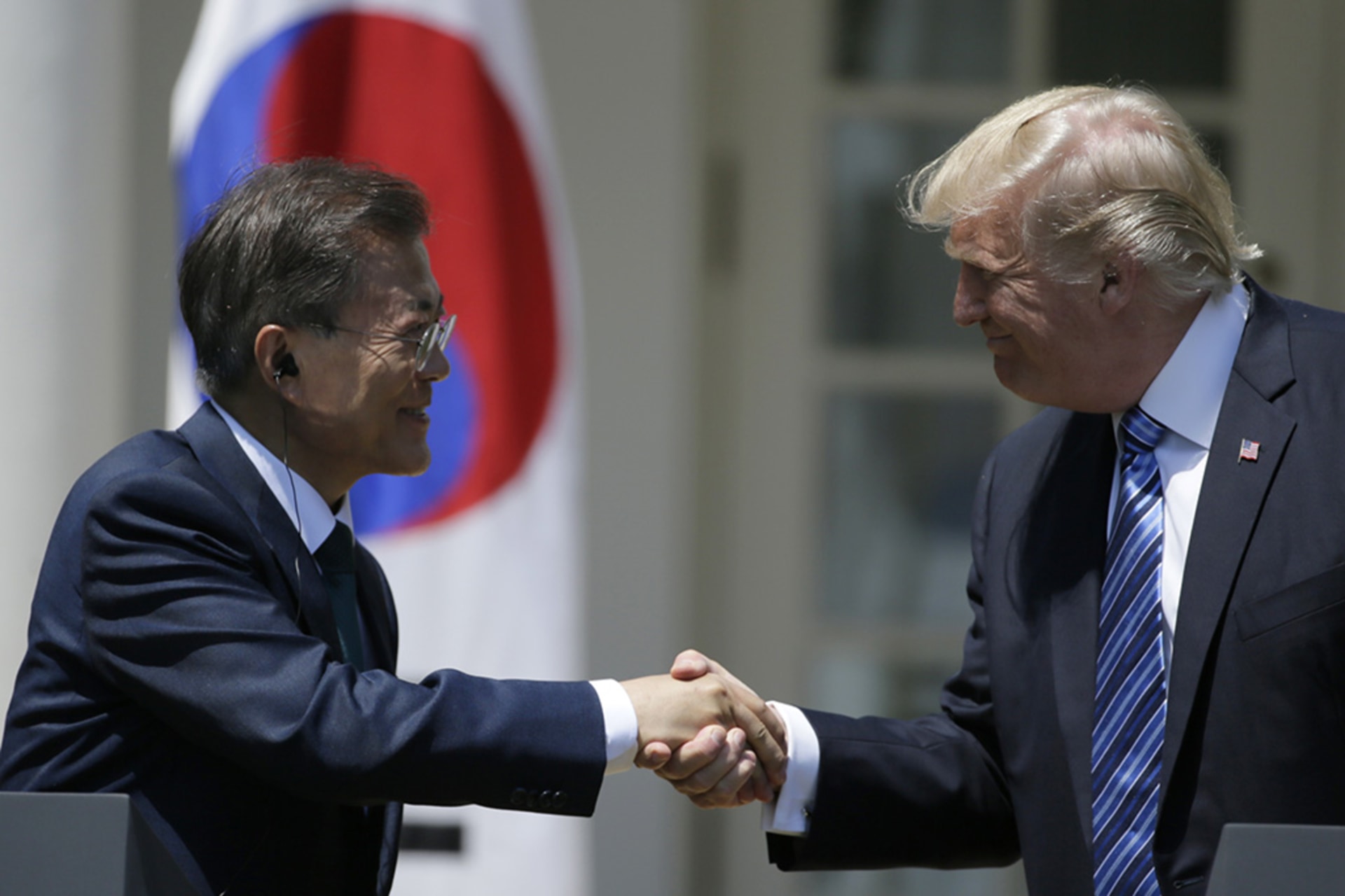 U.S. President Donald Trump shakes hands with South Korean President Moon Jae-in prior to delivering a joint statement at the White House in Washington, DC. Jim Bourg/Reuters