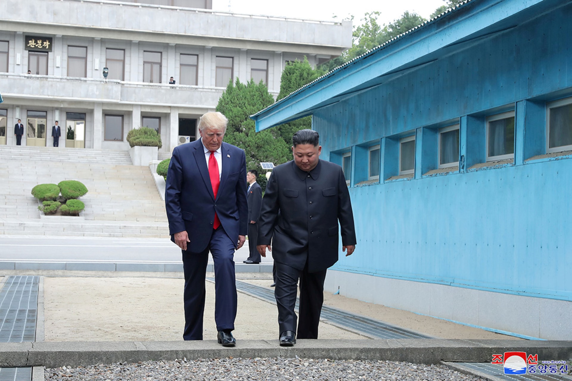 U.S. President Donald Trump and North Korean leader Kim Jong Un cross over the military demarcation line separating the two Koreas in Panmunjom, South Korea. KCNA/Reuters