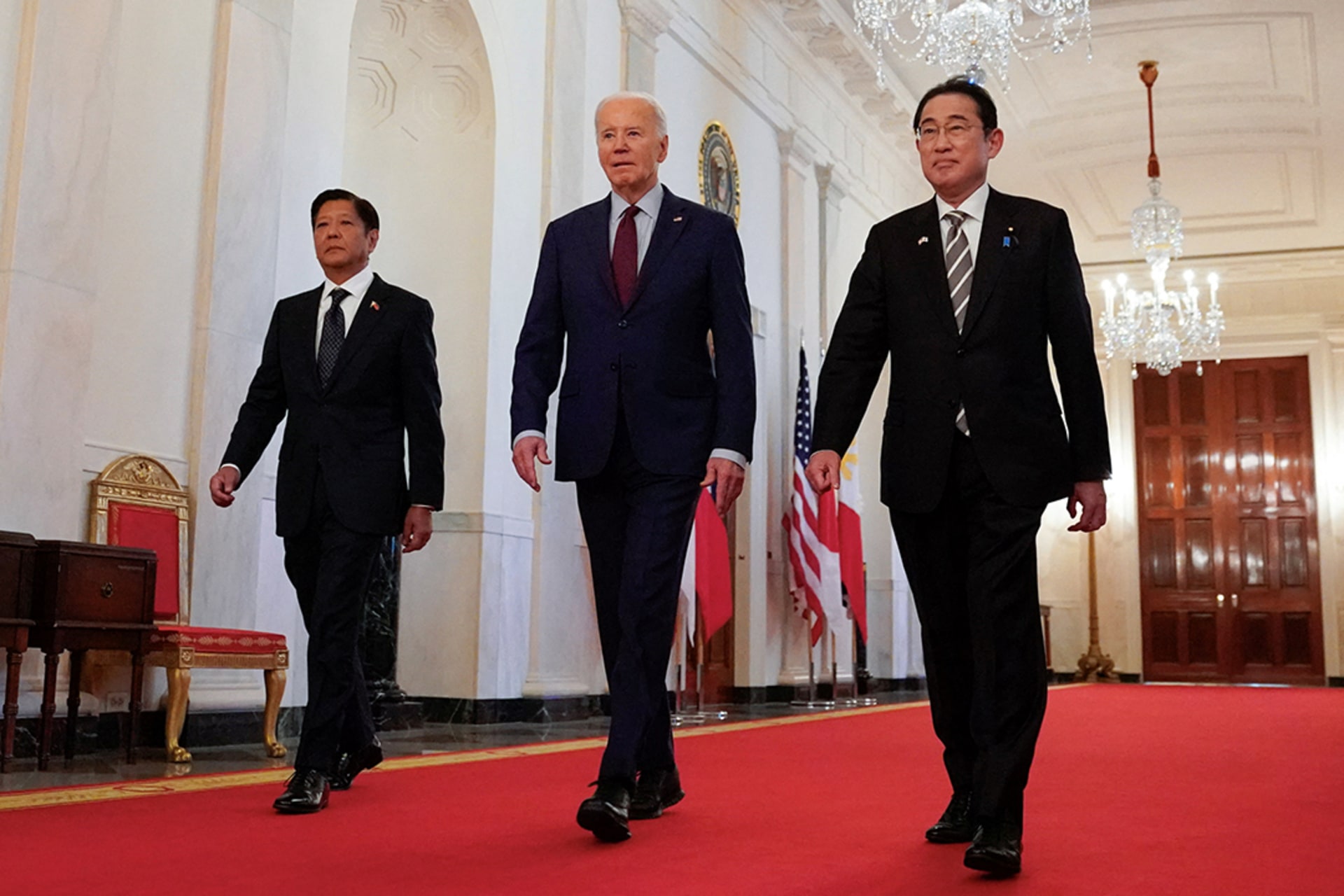U.S. President Joe Biden escorts Philippines President Ferdinand Marcos Jr. and Japan Prime Minister Fumio Kishida to their trilateral summit at the White House in Washington, DC. Kevin Lamarque/Reuters
