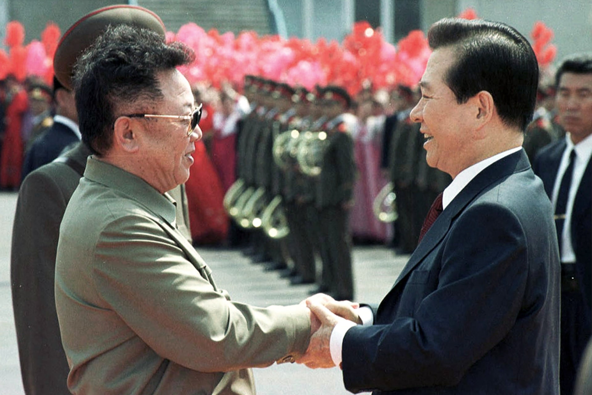 North Korea’s Kim Jong-il poses with the South’s Kim Dae-jung upon his arrival in Pyongyang. Reuters