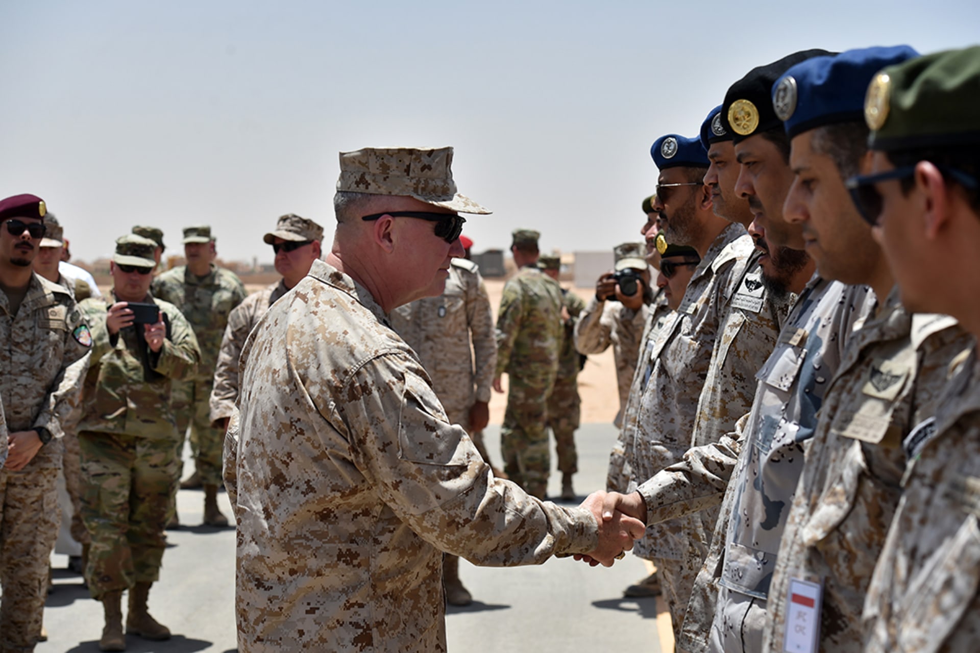 General Kenneth McKenzie, commander of U.S. Central Command, greets Saudi military officers during a 2019 visit to Saudi Arabia. Fayez Nureldine/AFP/Getty Images