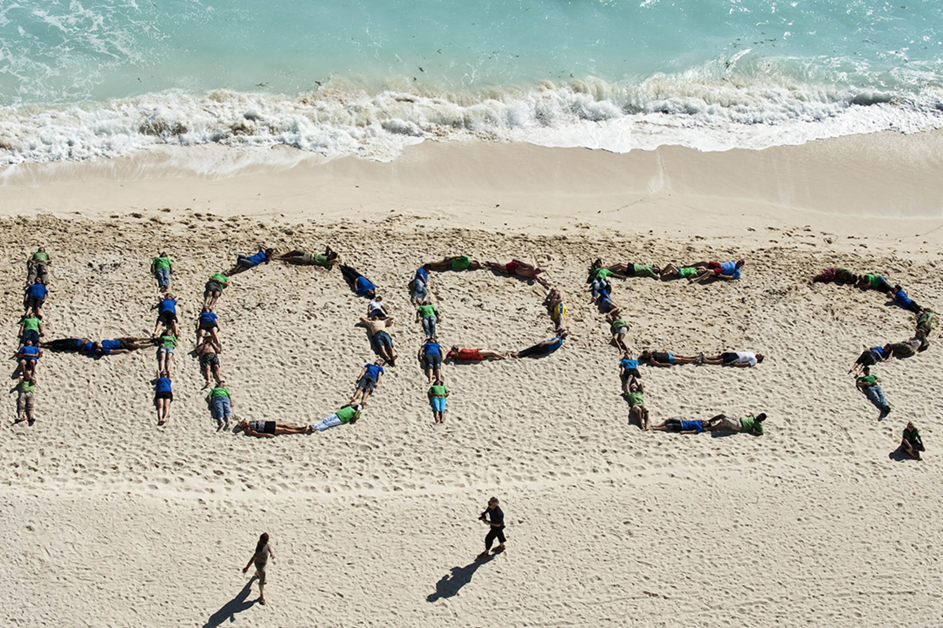 Environmental activists pose on a beach during the Cancun conference. Ronaldo Schemidt/AFP/Getty Images