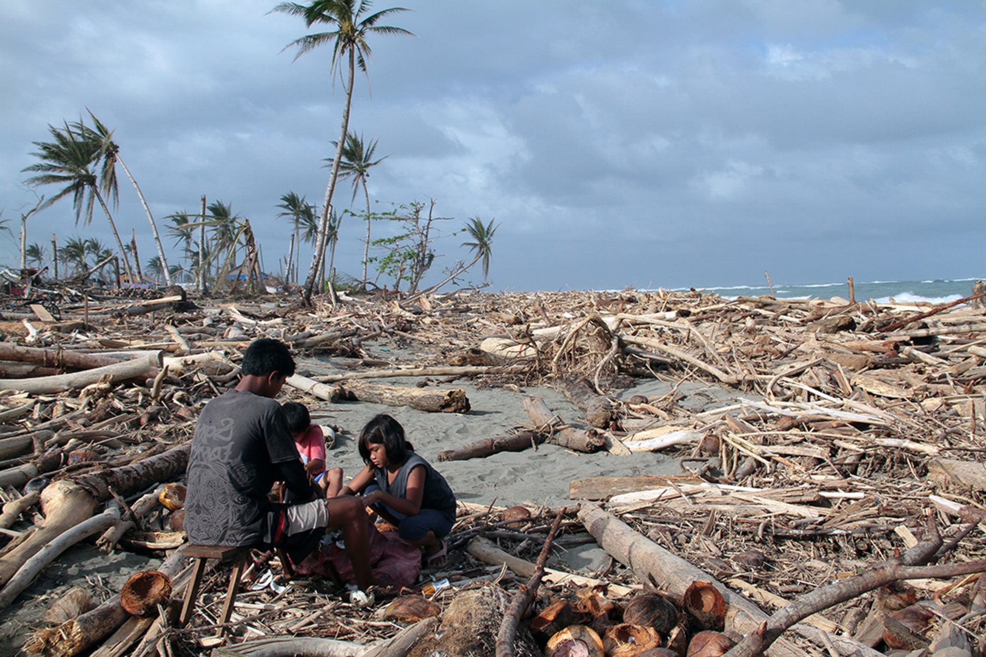 Typhoon Bopha kills more than one thousand people in the Philippines while the conference is in session. STR/AFP/Getty Images