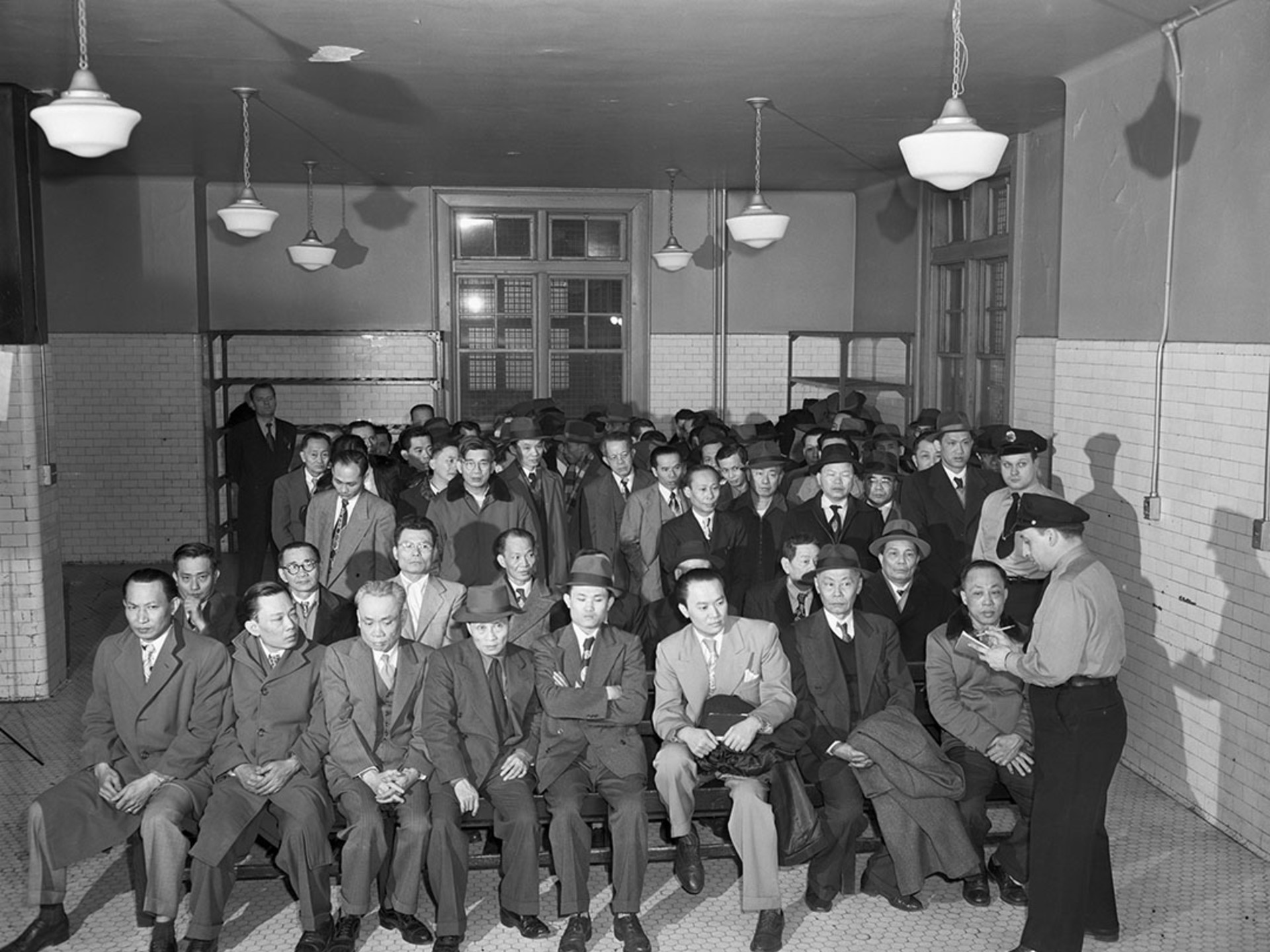 Chinese immigrants undergo an interrogation at Ellis Island. Bettmann/Getty Images