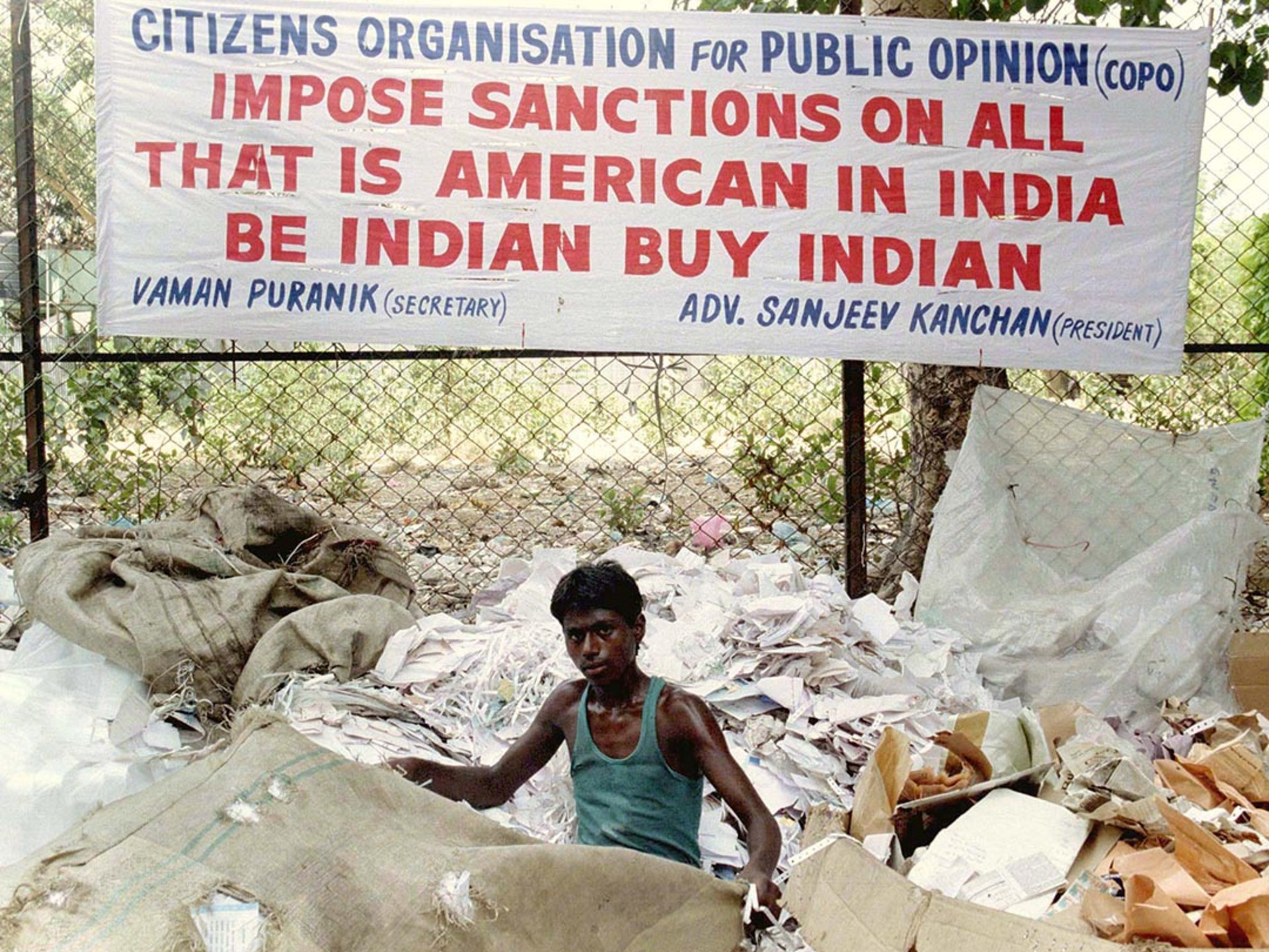 A banner encourages the boycott of U.S. goods after Washington imposes economic sanctions on India. Savita Kirloskar/Reuters