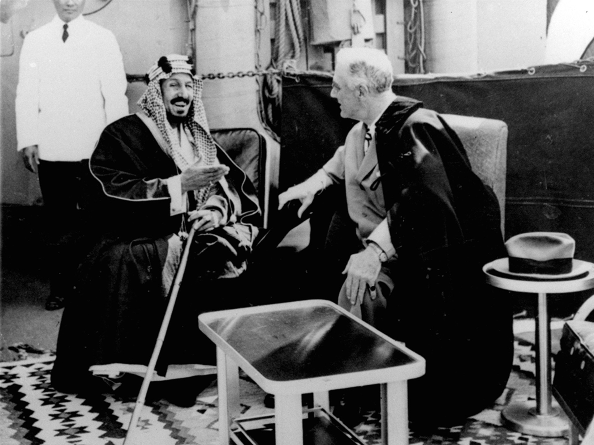 U.S. President Franklin D. Roosevelt and King Abdul Aziz Ibn Saud in discussion aboard the USS Quincy north of Suez, Egypt, on February 14, 1945. 
