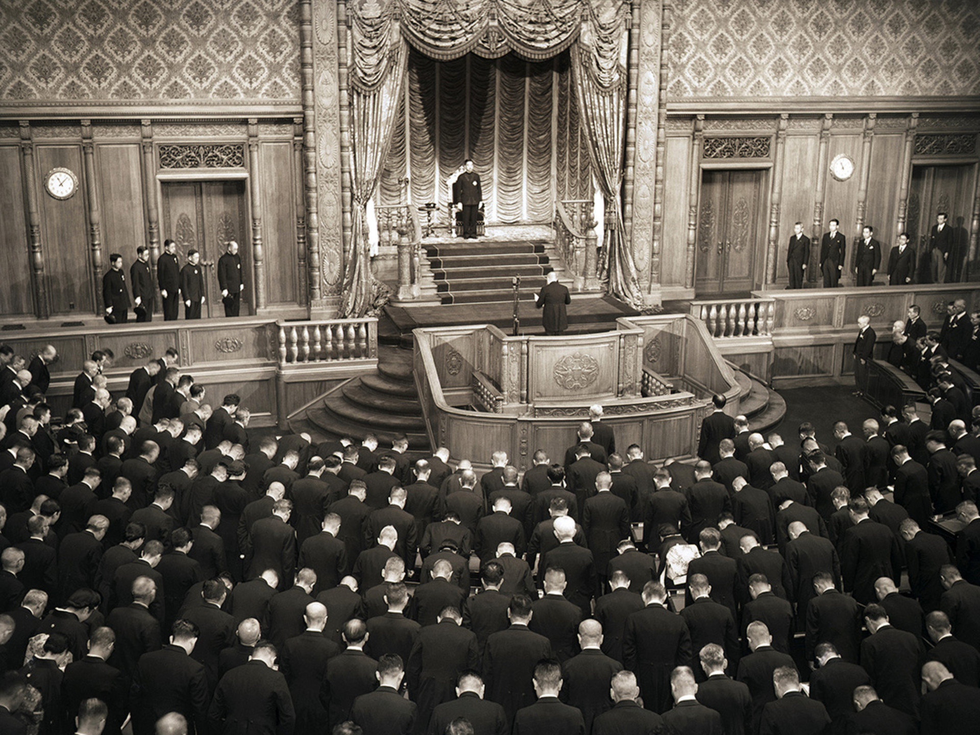 Emperor Hirohito stands before the Japanese Diet to endorse the new constitution. 
